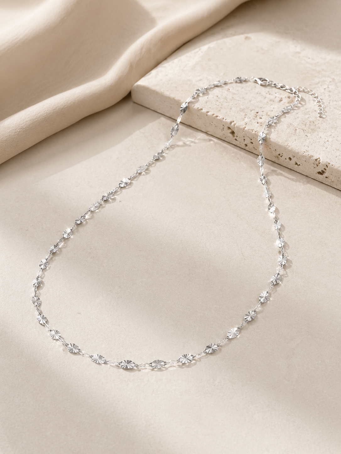 CARV. silver facet single chain necklace with elongated faceted links studio flatlay