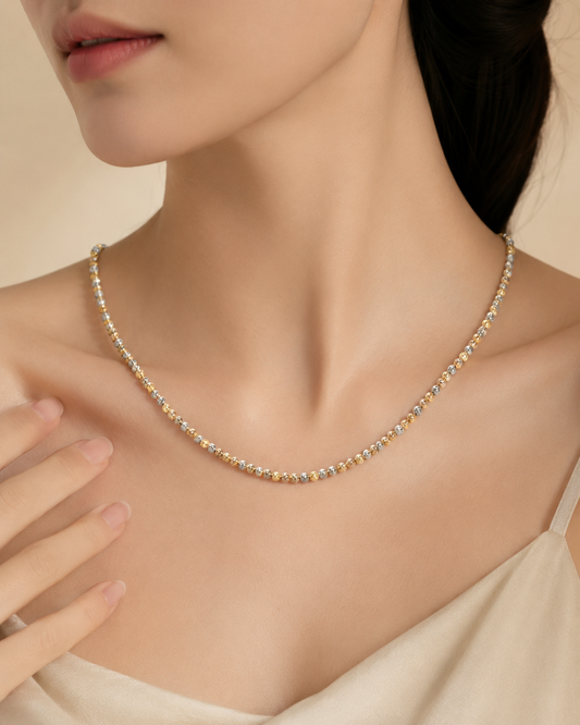 CARV. tri-tone beaded chain necklace worn at collarbone with mixed metallic bead detail