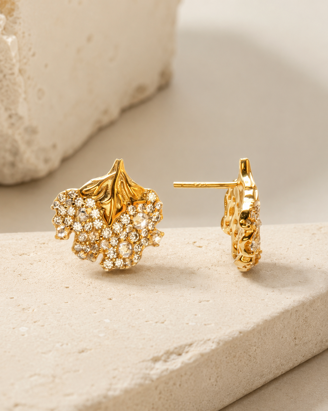 CARV. gold floral leaf stud earrings with pavé crystal cluster product display