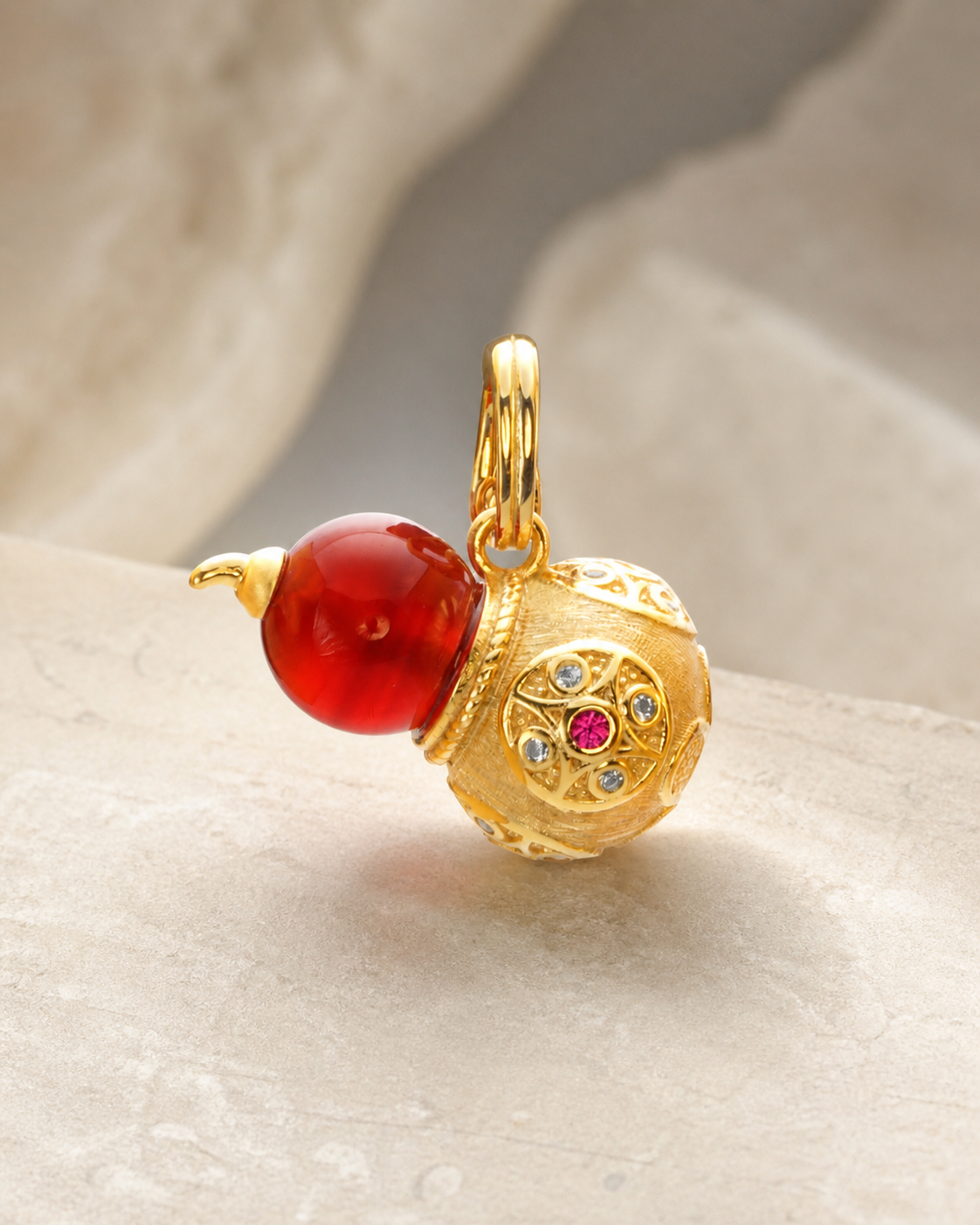 CARV. gold gourd pendant necklace with red bead, crystal detail and engraved round charm product display