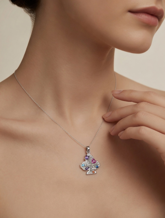 CARV. silver club pendant necklace worn at collarbone with multicolour stones and filigree detail