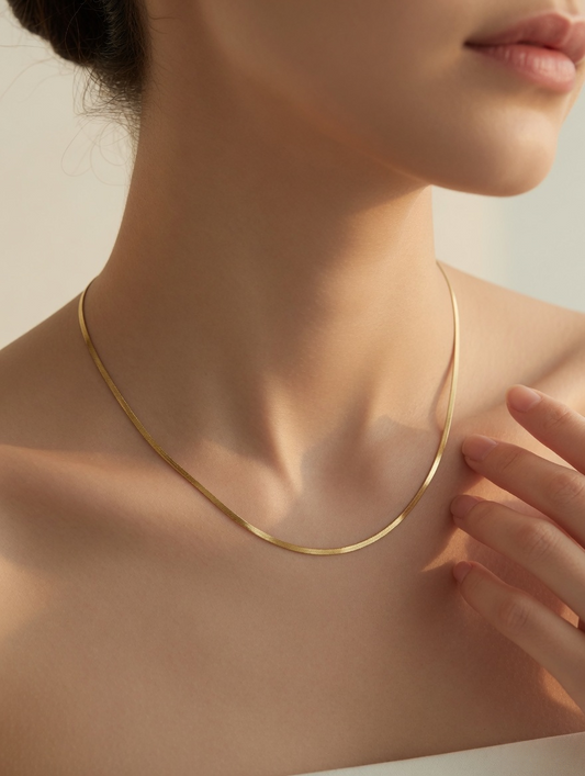 CARV. gold silk snake chain necklace worn on neck