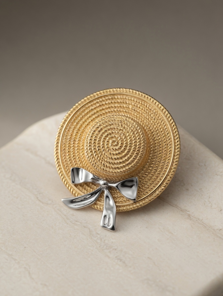 CARV. gold straw hat pendant necklace with spiral disc pendant, silver bow and fine chain detail