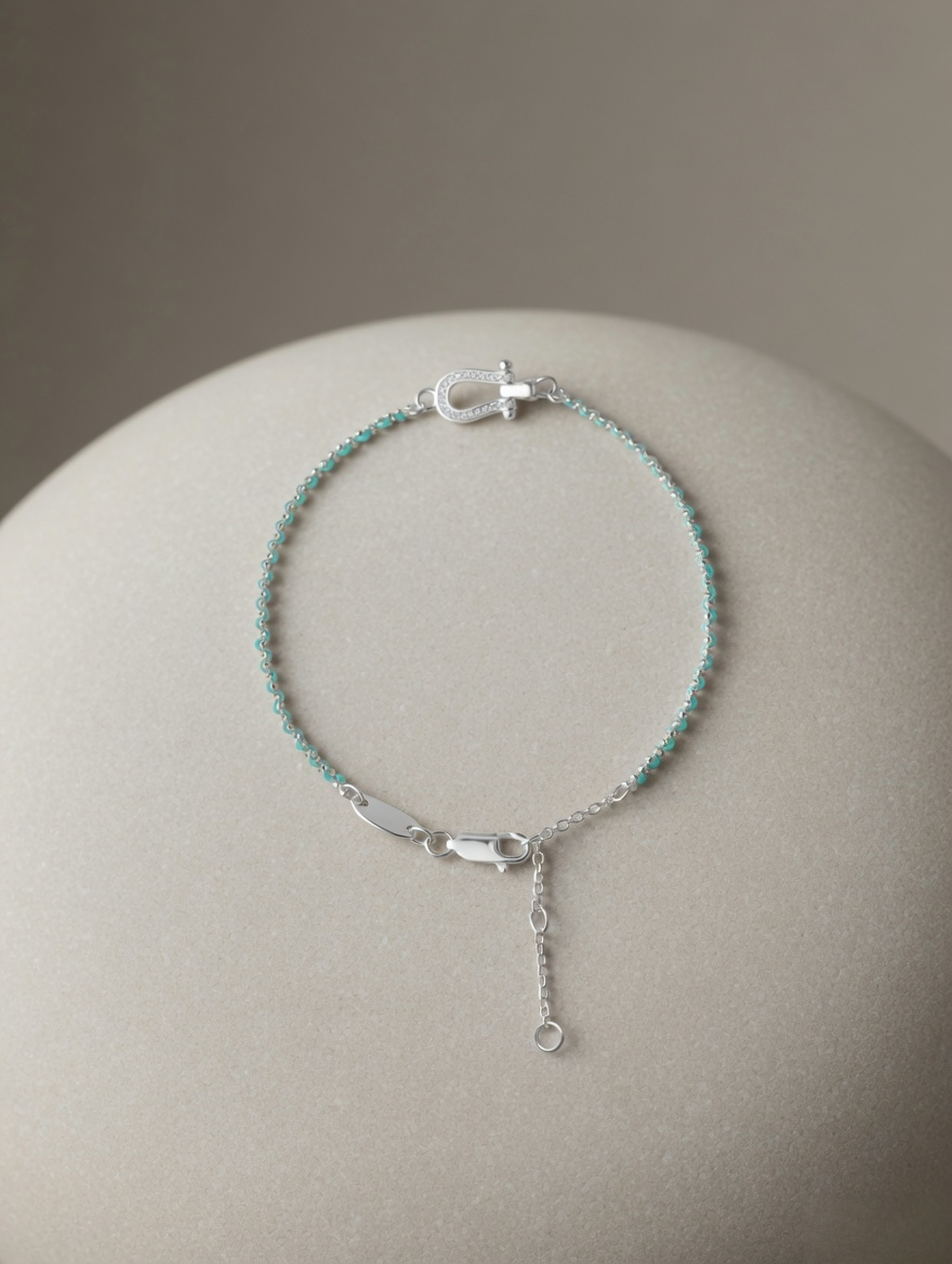 CARV. turquoise beaded bracelet with silver bar accent, clasp and adjustable chain detail