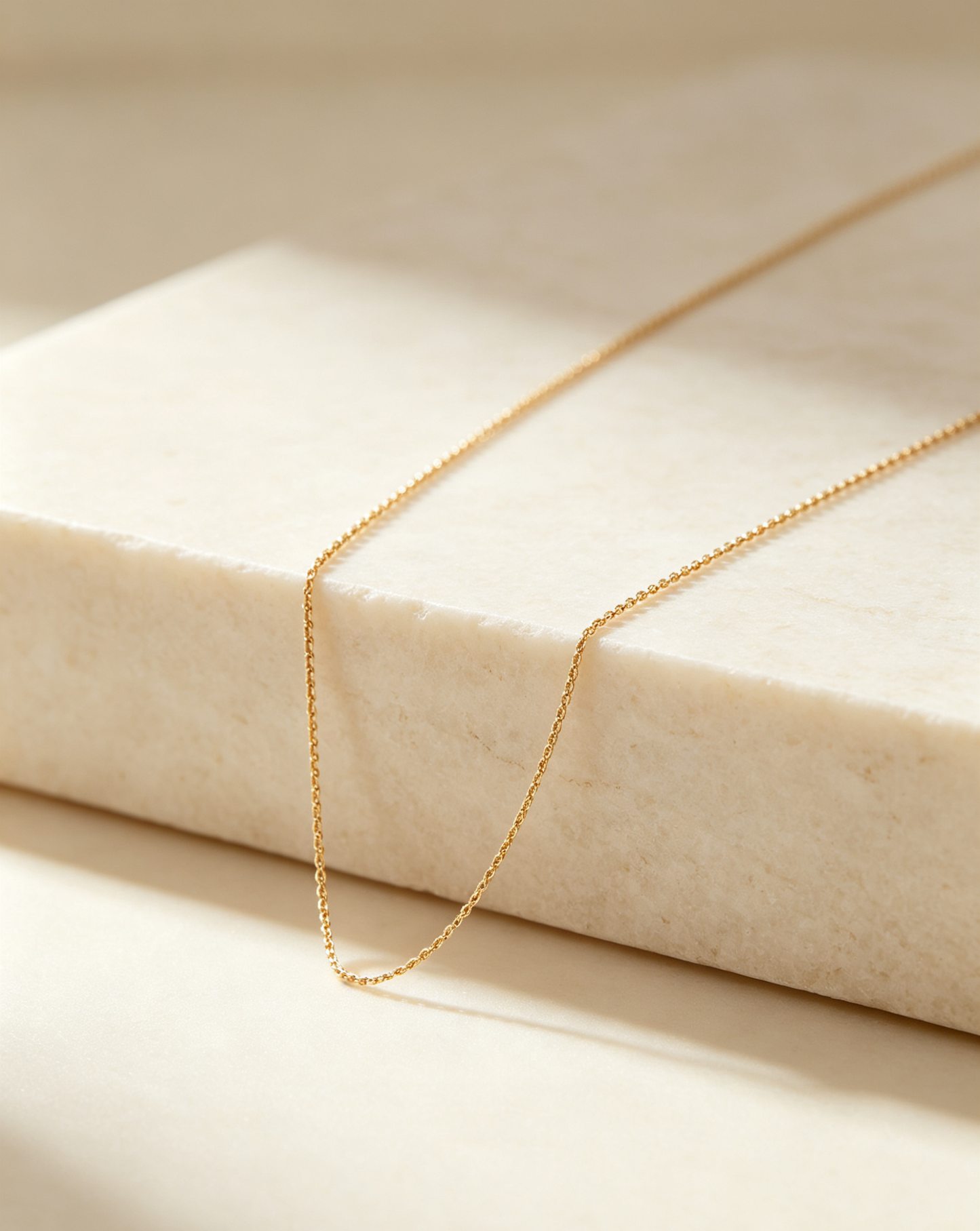 CARV. gold twist chain necklace with fine twisted chain links and clasp detail displayed flat