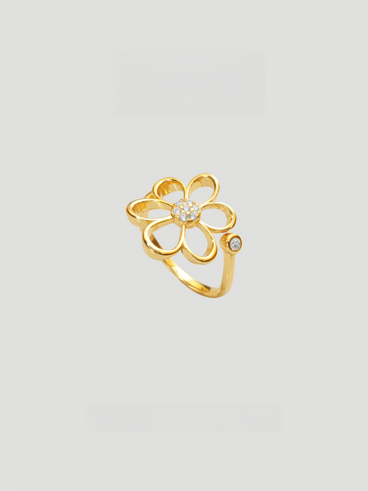 CARV. gold daisy flower ring with crystal center and open petal design product close-up
