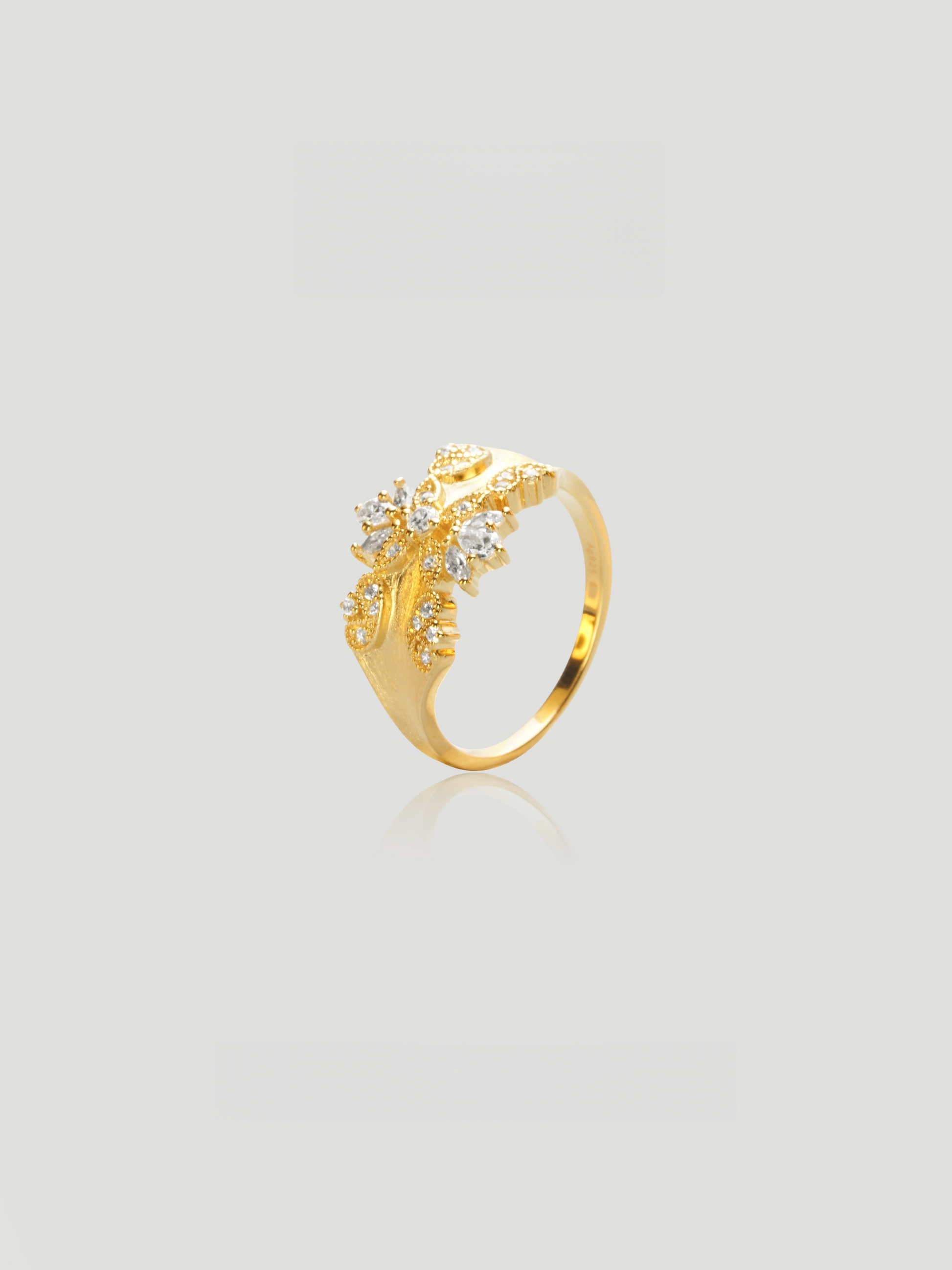 CARV. gold floral statement ring with crystal cluster, leaf detail and polished band