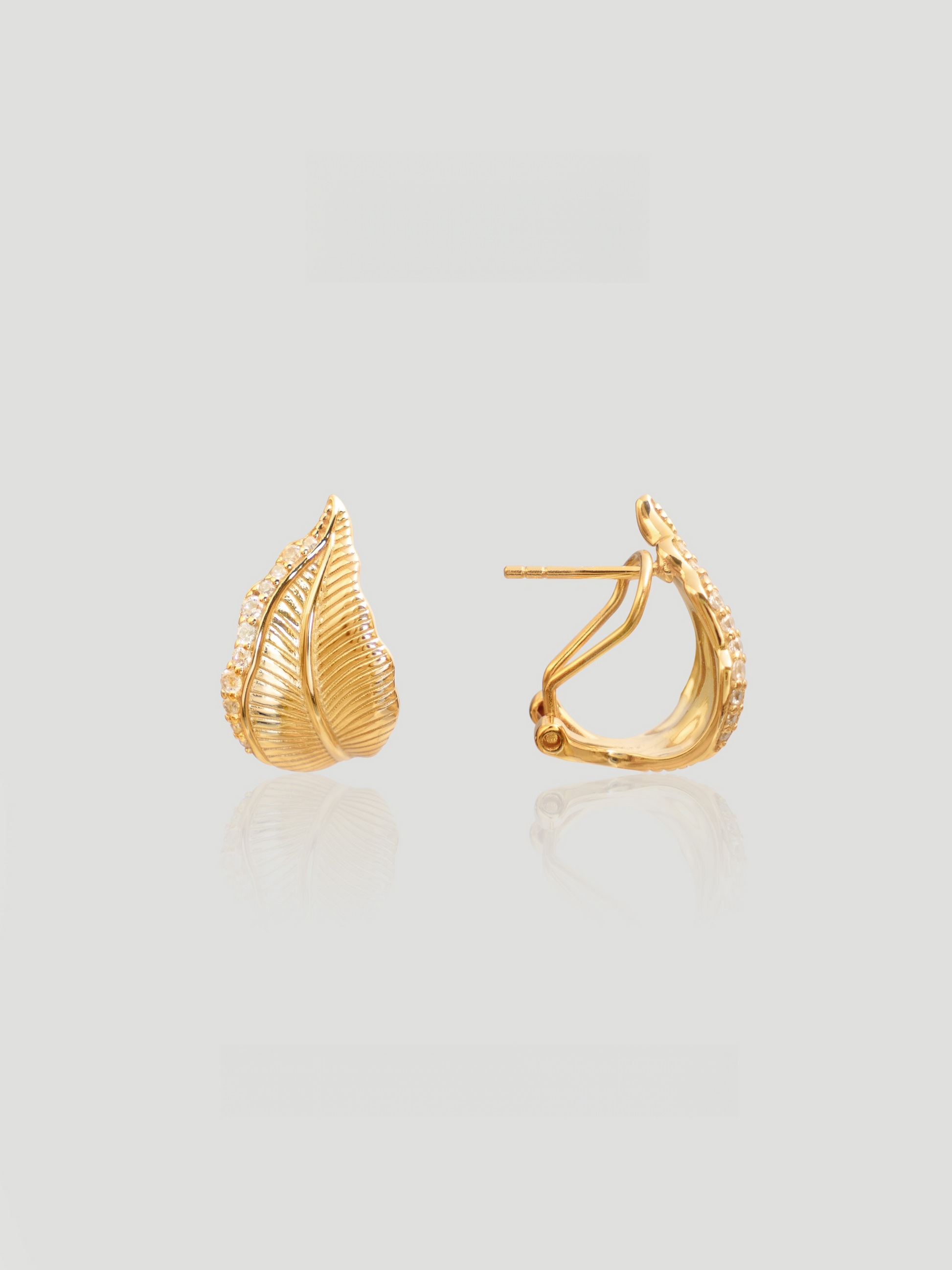 CARV. gold leaf stud earrings with pavé detail and sculpted leaf silhouette product close-up