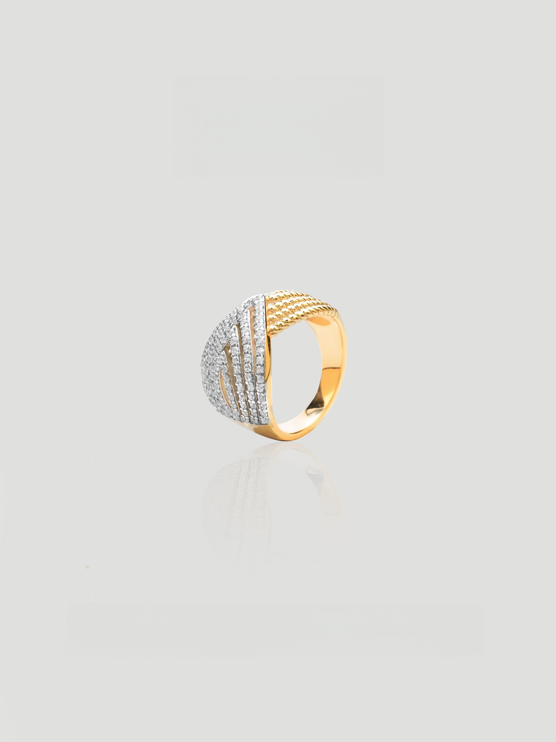 CARV. two-tone pavé crossover ring with ribbed gold band, silver pavé detail and sculptural wrap design