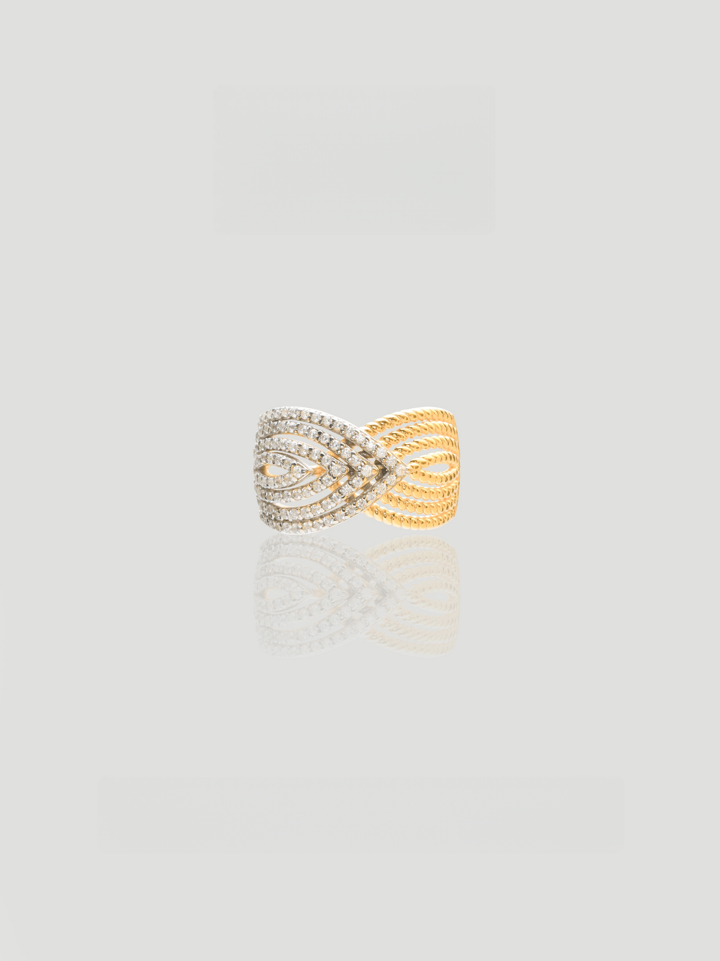 CARV. two-tone pavé crossover ring with ribbed gold band, silver pavé centre and wrap ring design