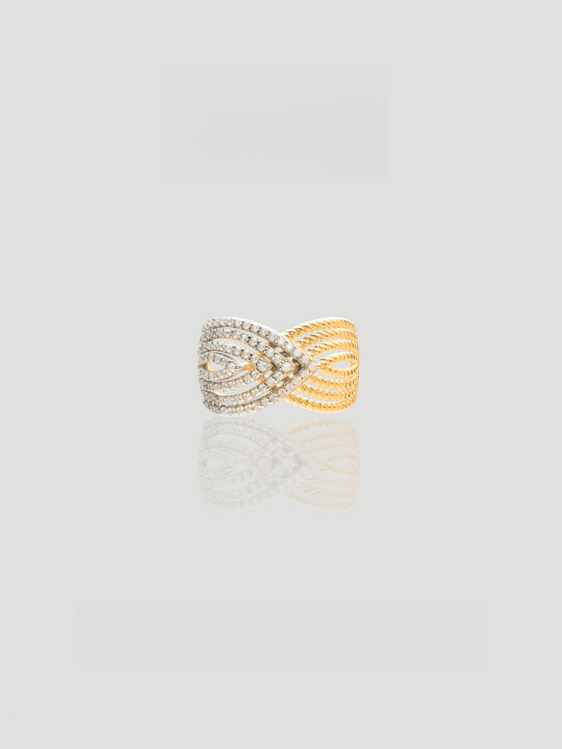 CARV. two-tone pavé crossover ring with ribbed gold band, silver pavé centre and wrap ring design