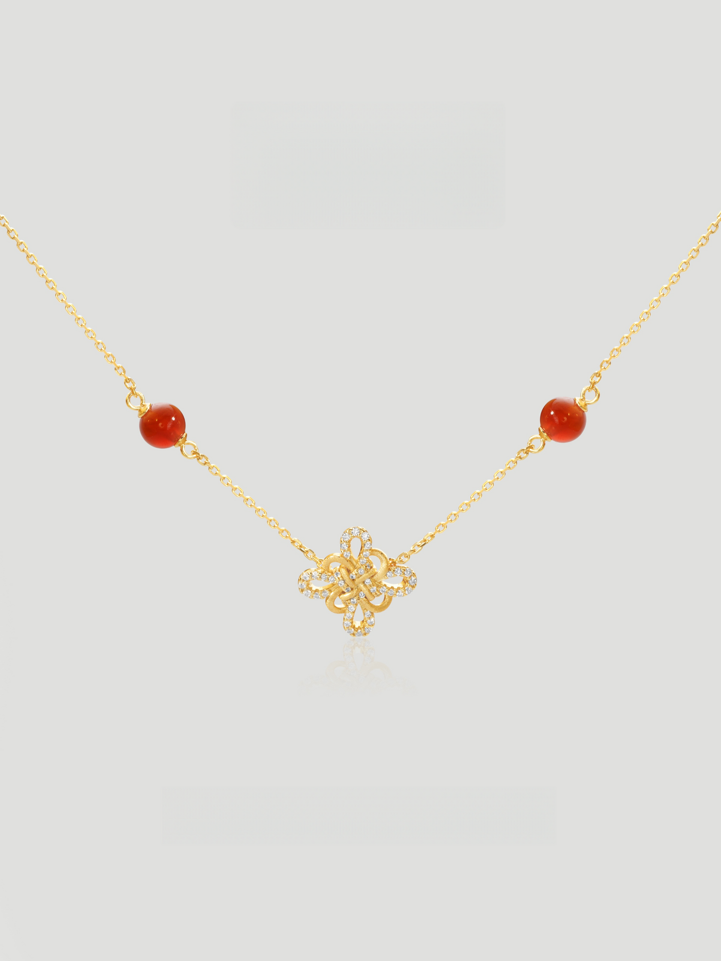 CARV. gold red agate knot necklace with red bead stations, knot pendant and fine chain