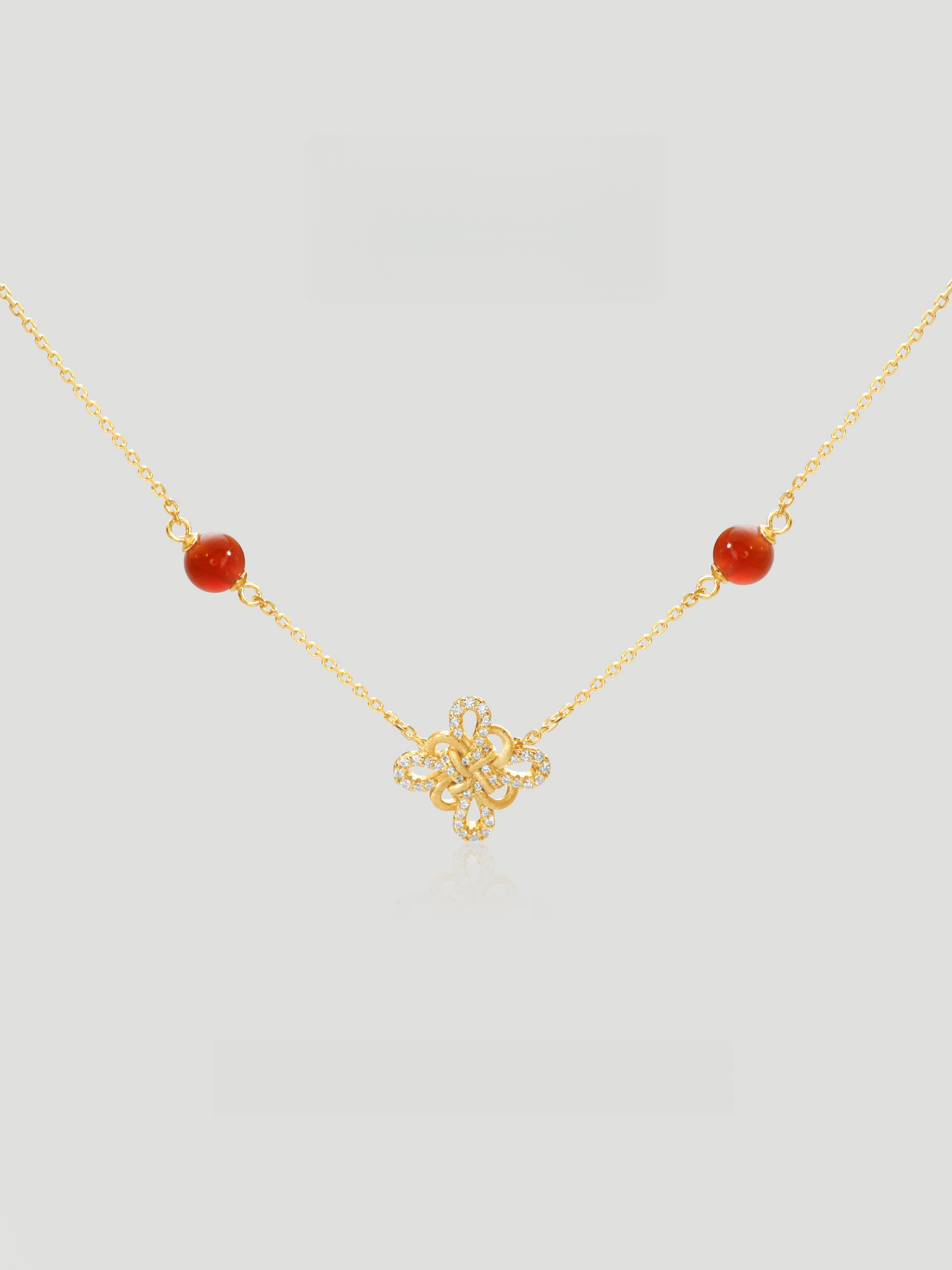 CARV. gold red agate knot necklace with red bead stations, knot pendant and fine chain