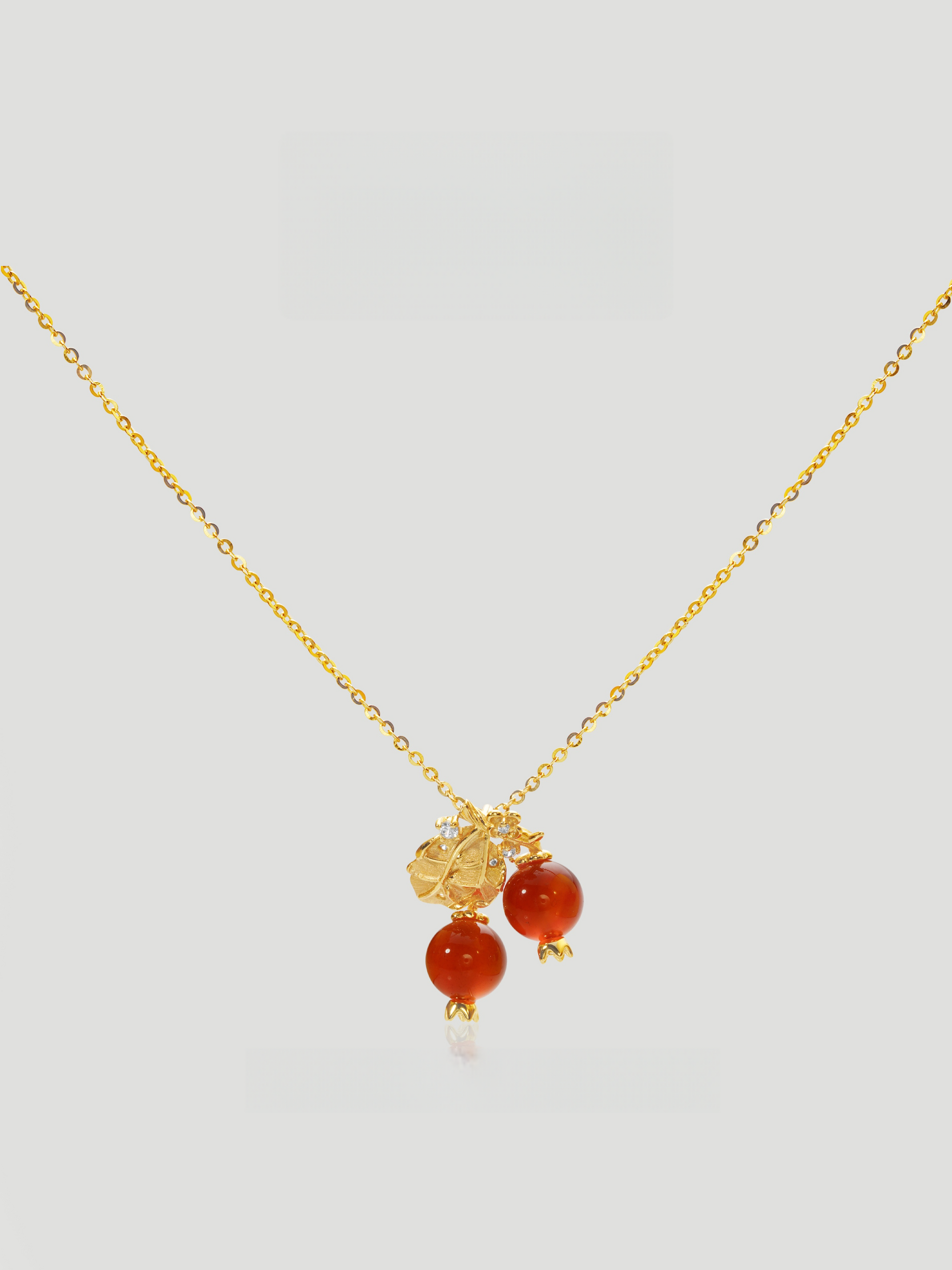 CARV. gold red berry pendant necklace with double red bead drops, leaf charm and fine chain