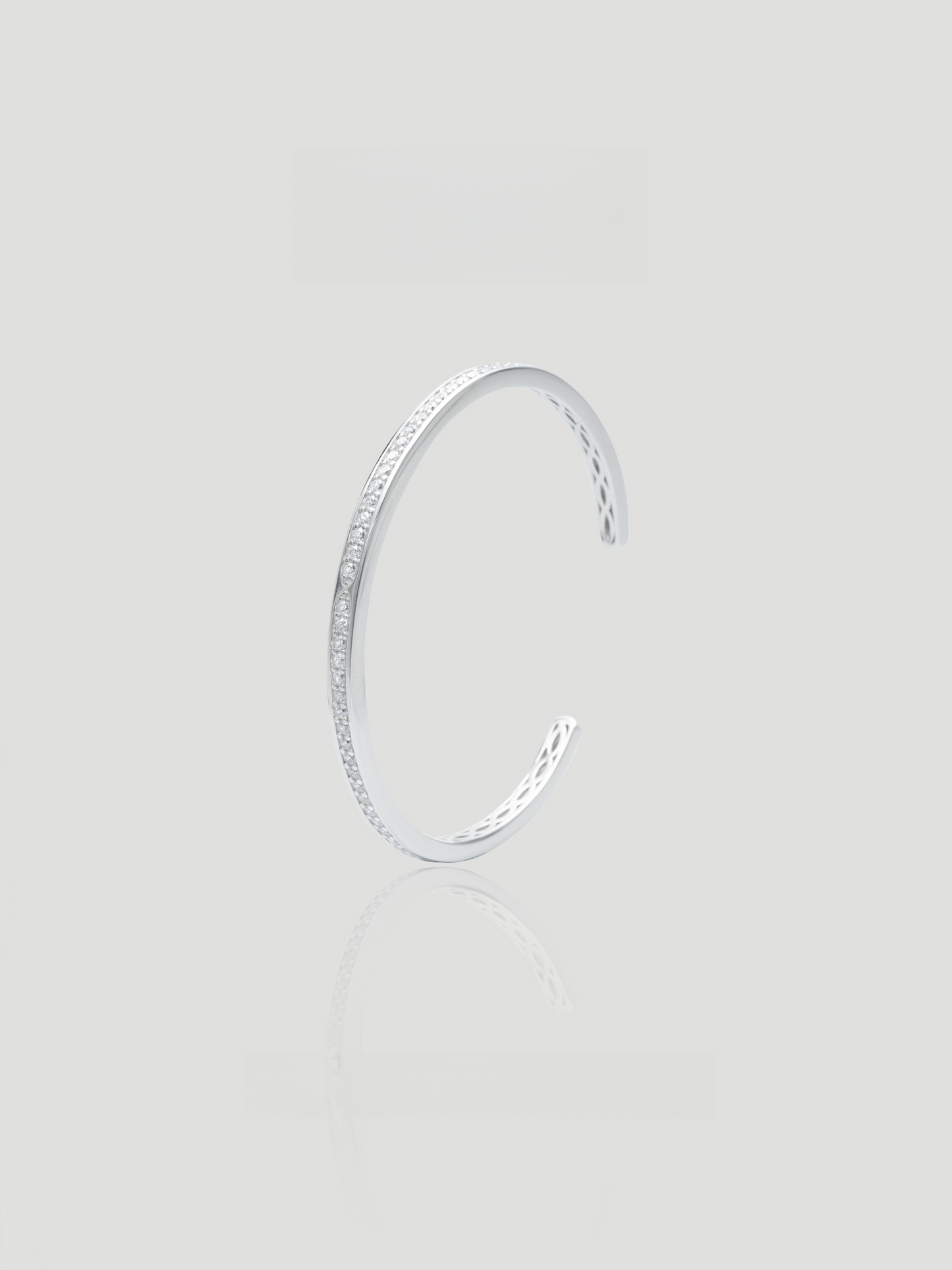 CARV. silver open cuff bangle with slim curved shape and pavé crystal detail