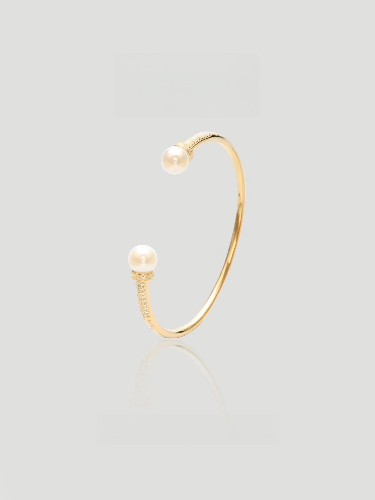 CARV. gold pearl open cuff bangle with open-ended design and pearl ball accents