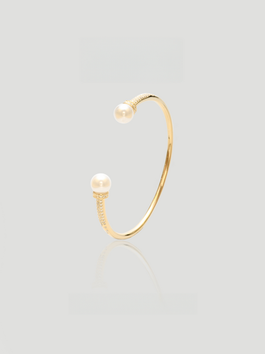 CARV. gold pearl open cuff bangle with open-ended design and pearl ball accents