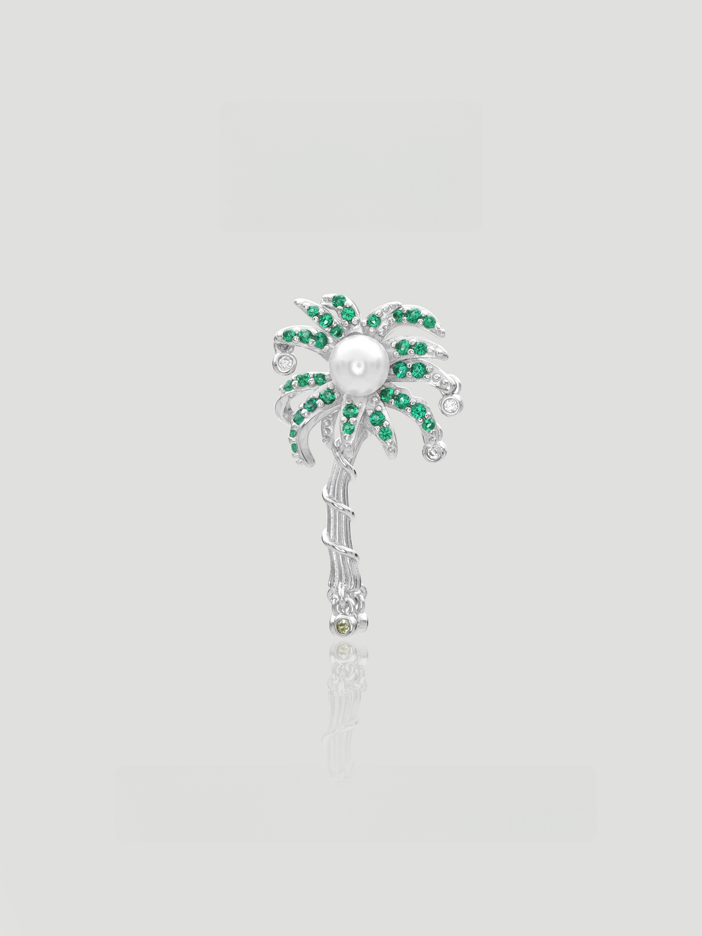CARV. silver palm tree pendant with pearl center, green stone leaves and clear stone accents