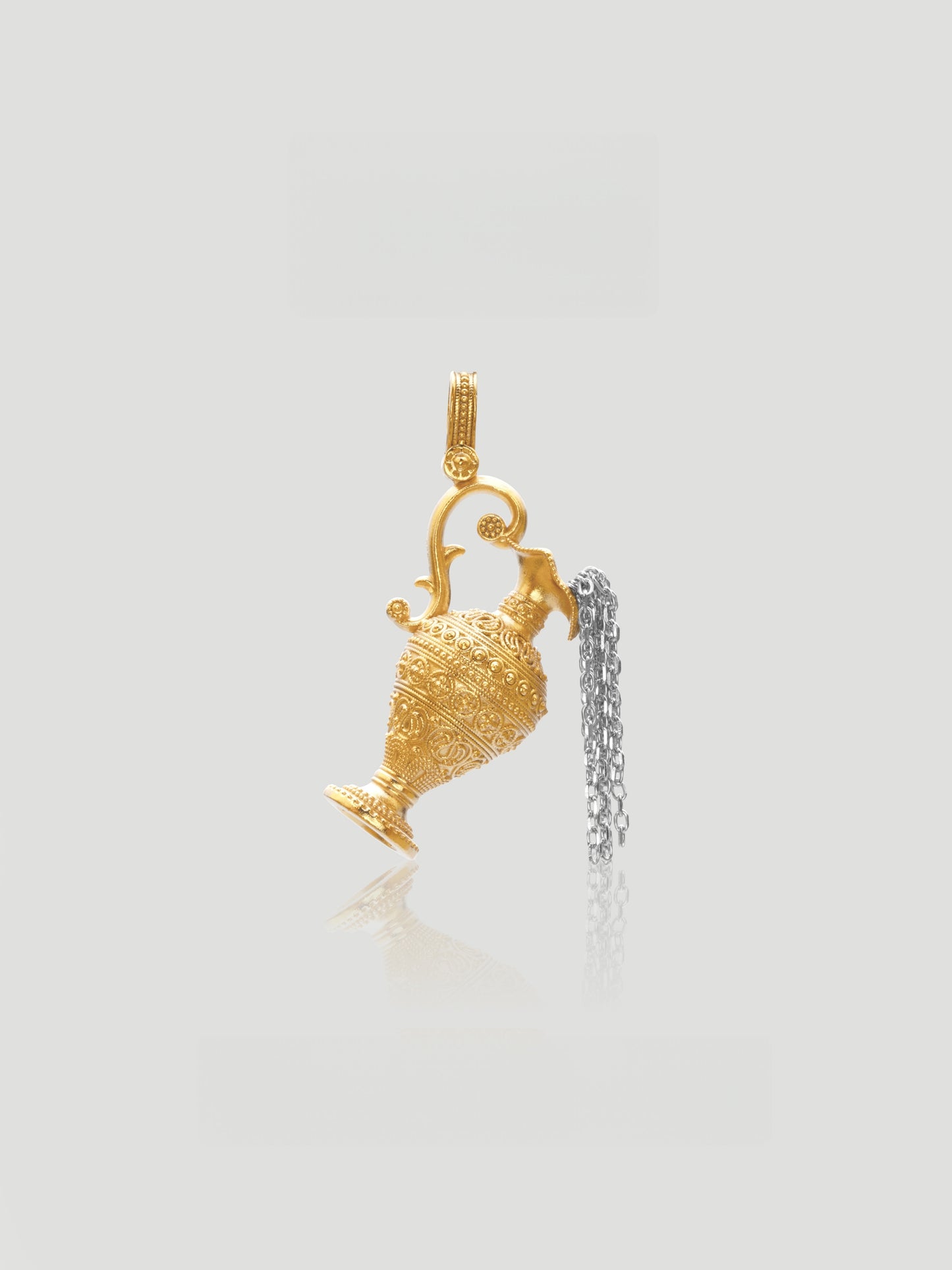 CARV. two-tone ewer pendant necklace with gold vessel charm and silver tassel detail product close-up