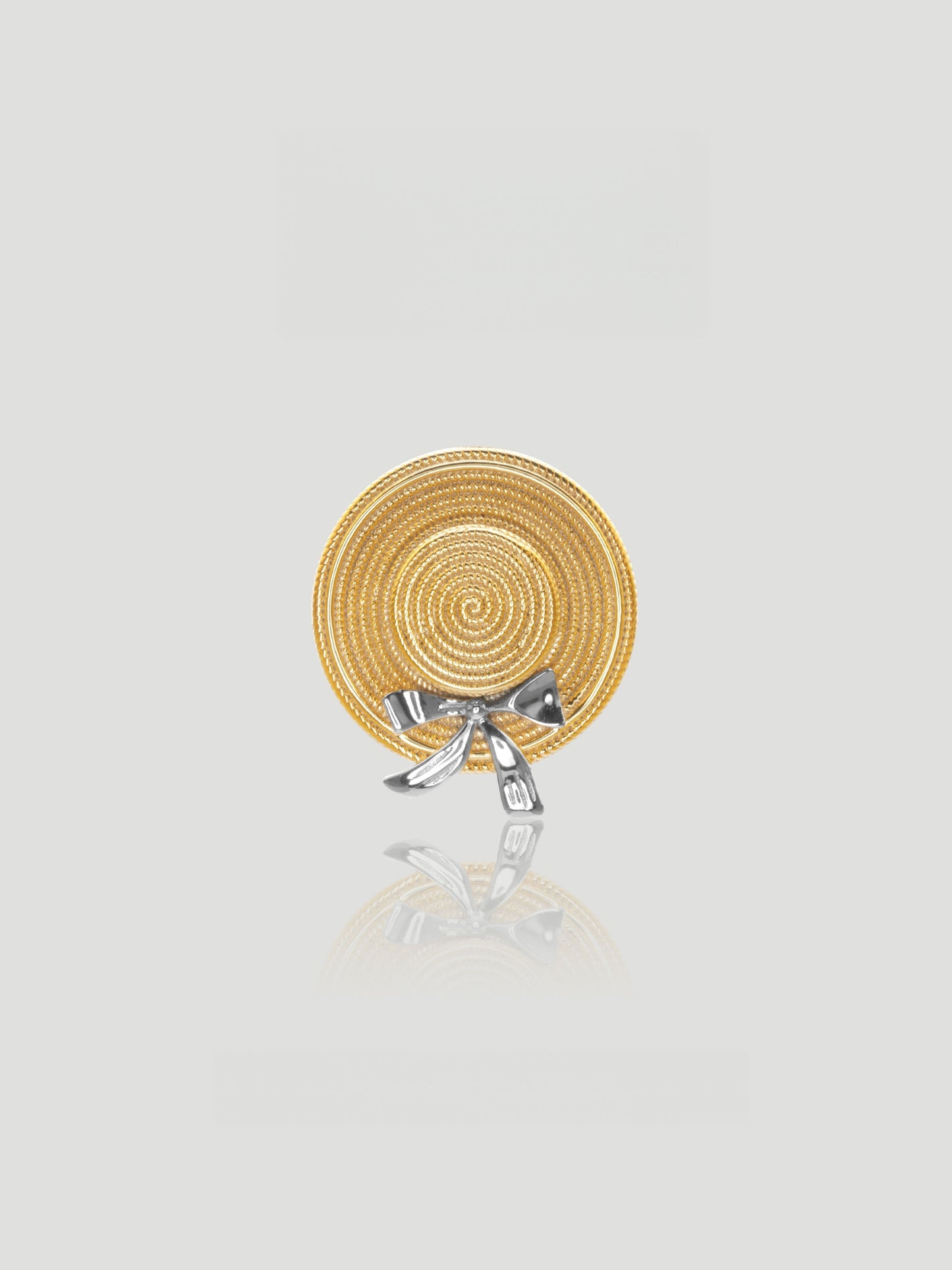 CARV. gold straw hat pendant necklace with spiral disc charm and silver bow detail