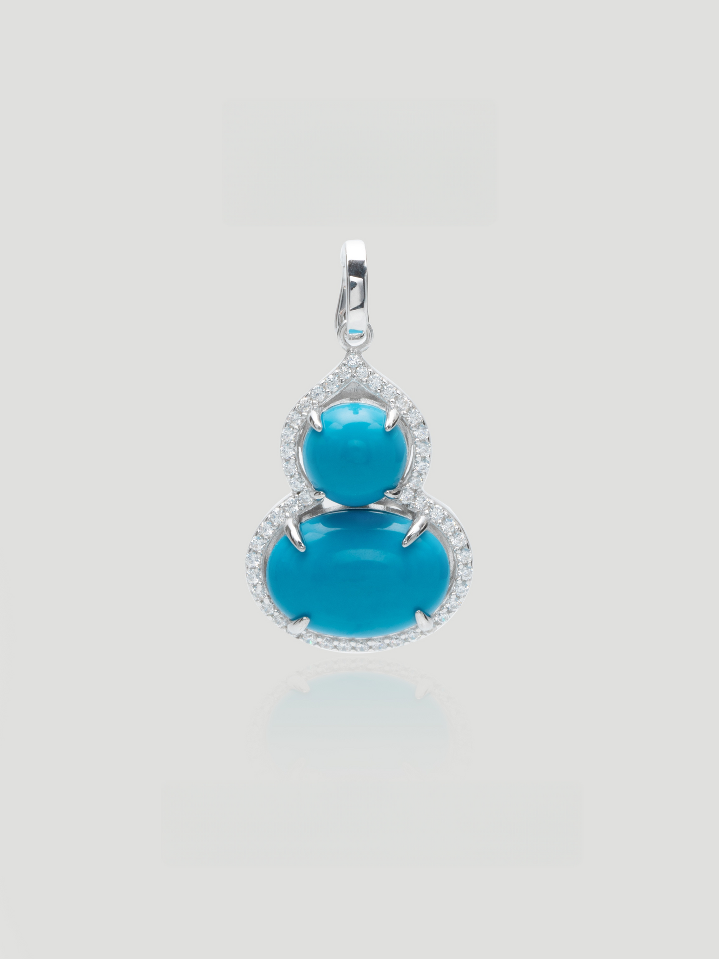 CARV. silver turquoise gourd pendant with double blue stones and pavé halo setting