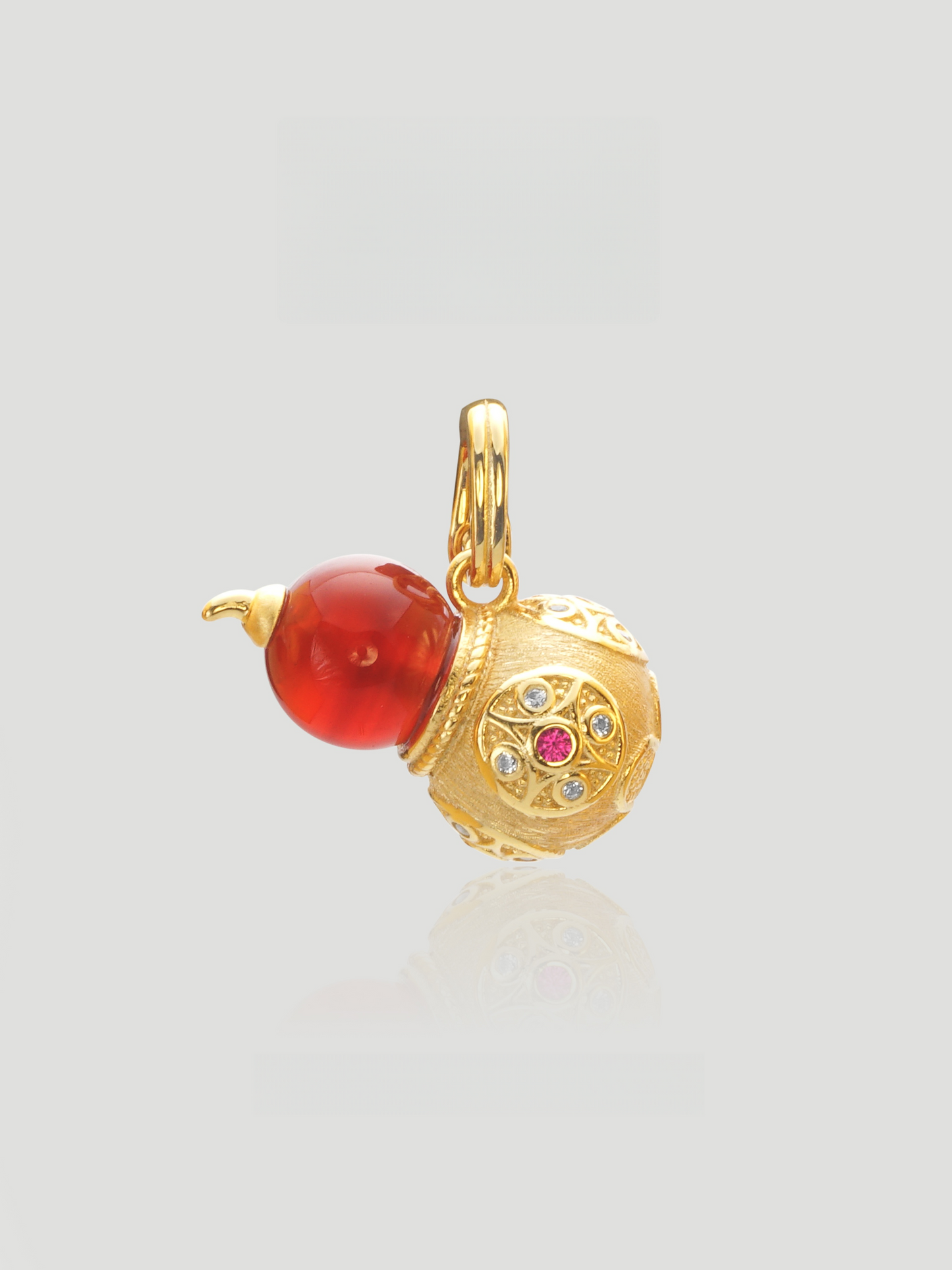 CARV. gold gourd pendant necklace with red bead, crystal detail and engraved round charm product close-up