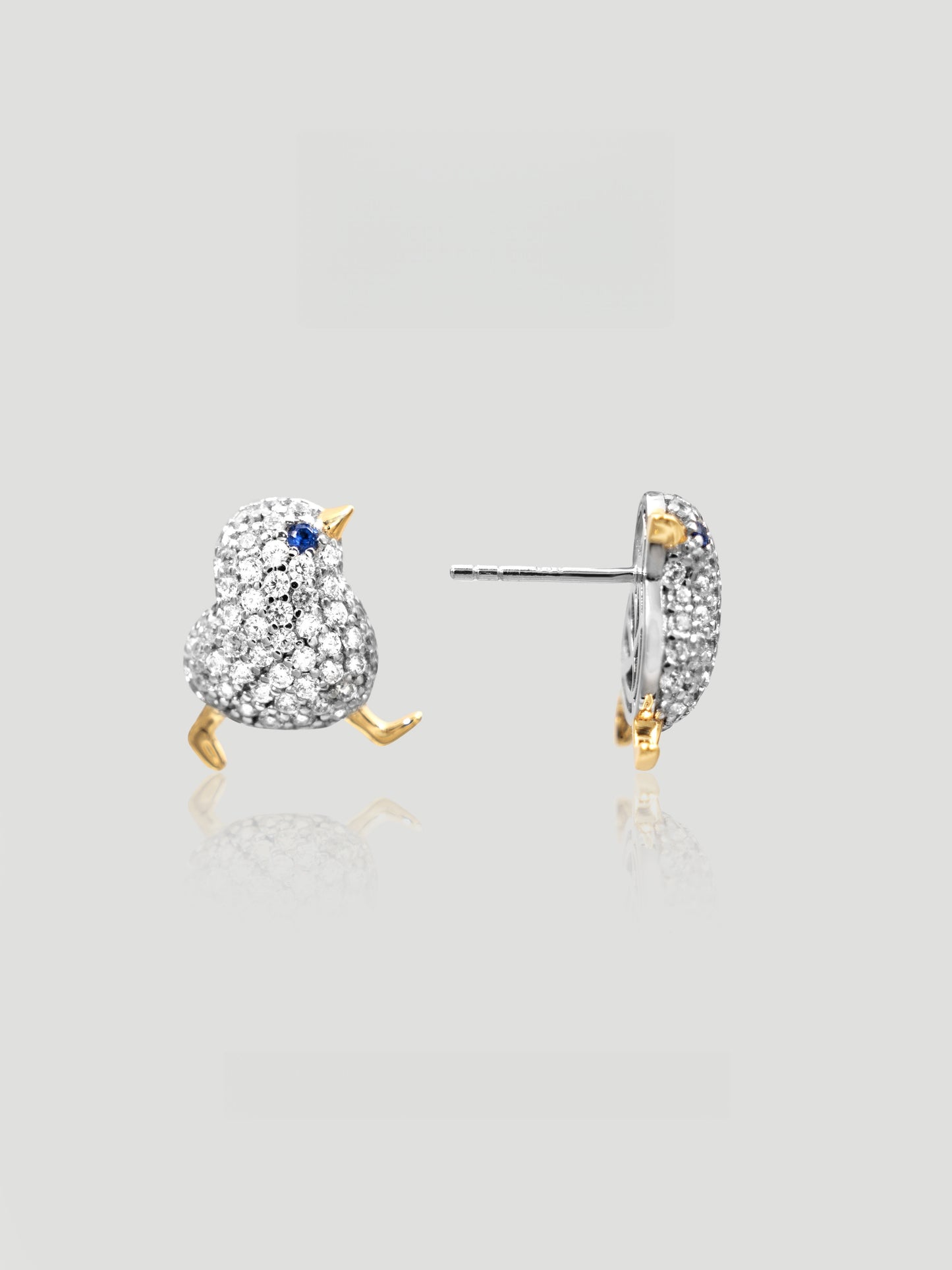CARV. two-tone bird stud earrings with blue stone eye, silver pavé body and gold beak and feet