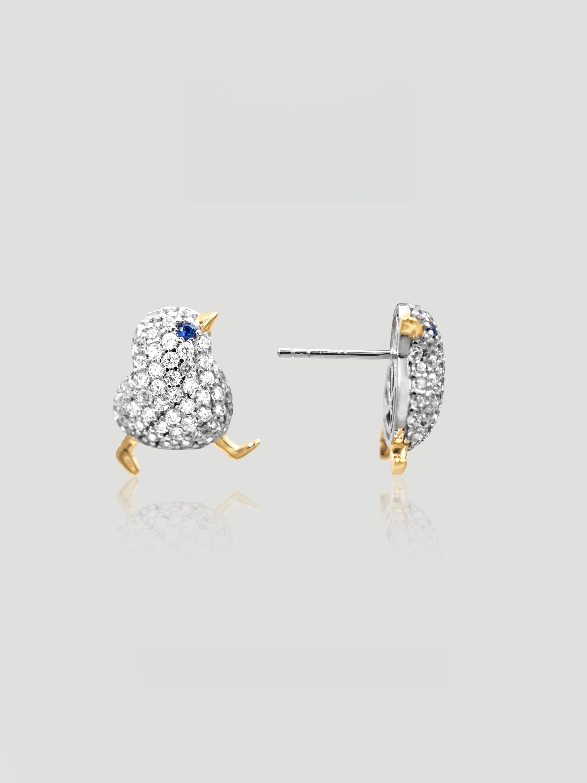 CARV. two-tone bird stud earrings with blue stone eye, silver pavé body and gold beak and feet