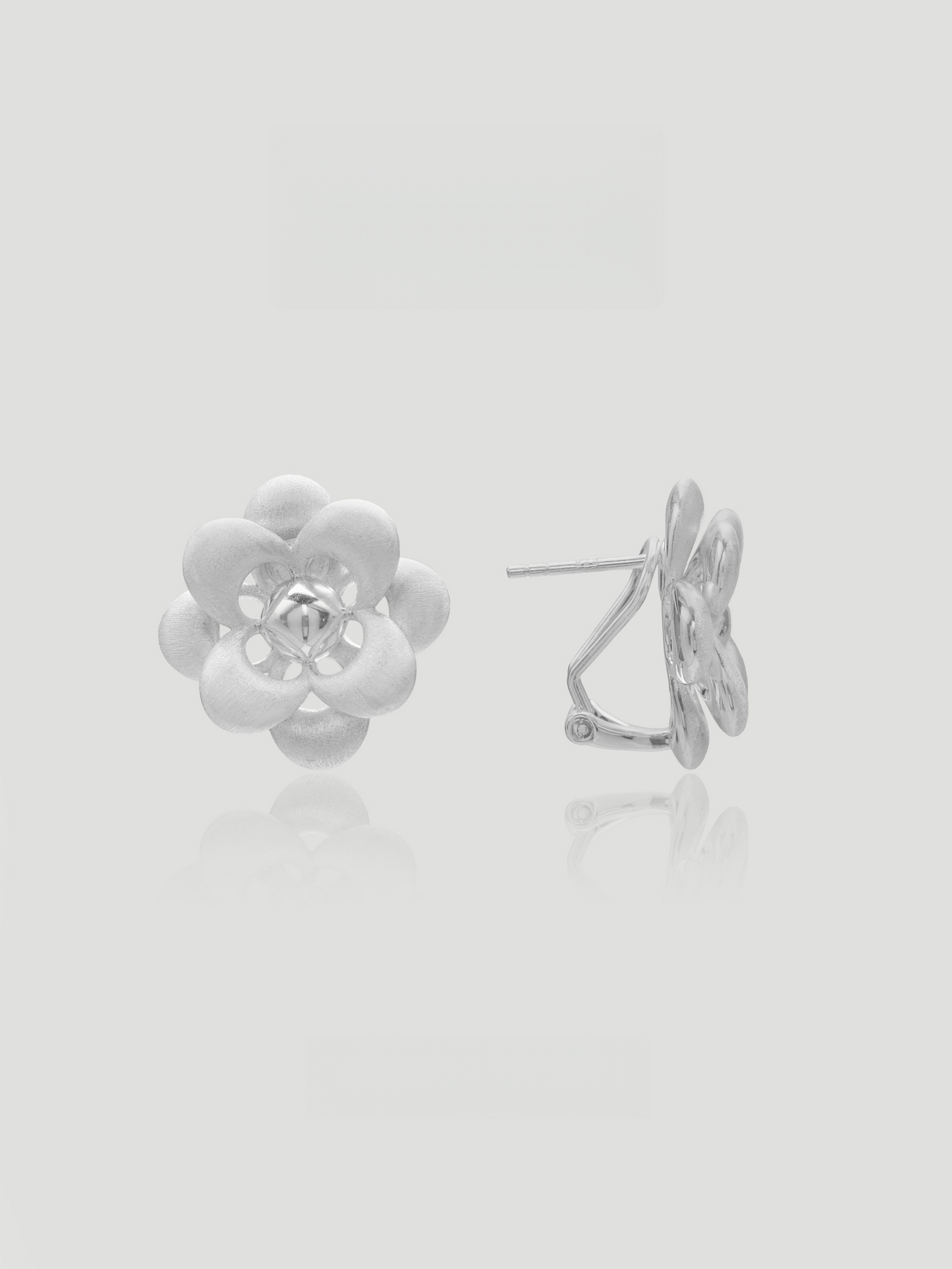 CARV. silver flower stud earrings with layered petal design and sculptural floral center
