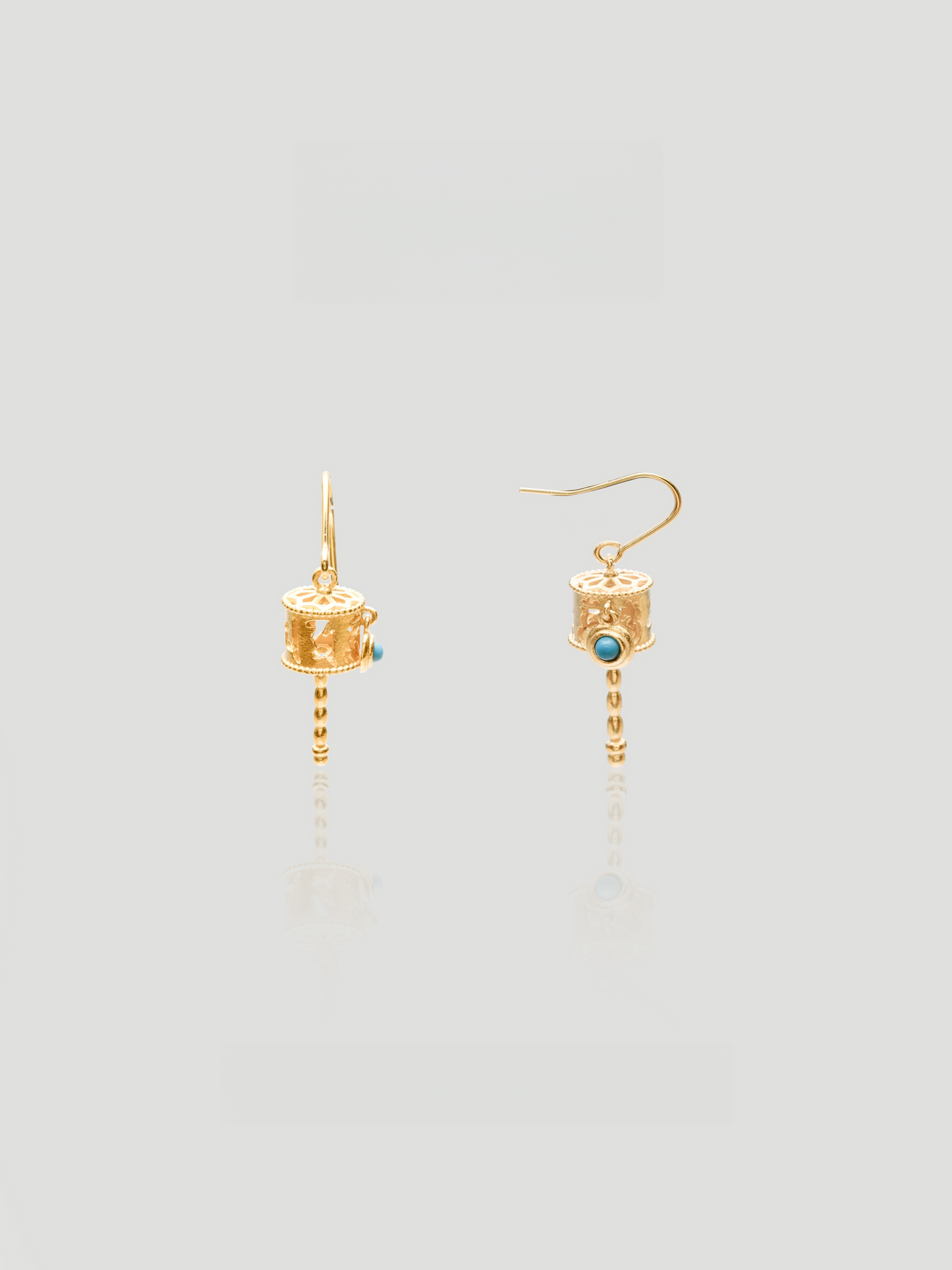 CARV. gold lantern drop earrings with turquoise stone detail and dangling beaded chain
