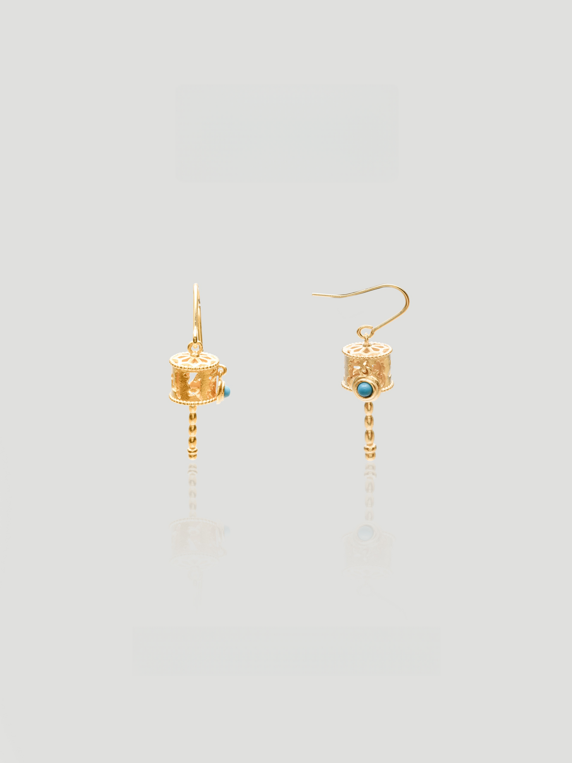 CARV. gold lantern drop earrings with turquoise stone detail and dangling beaded chain