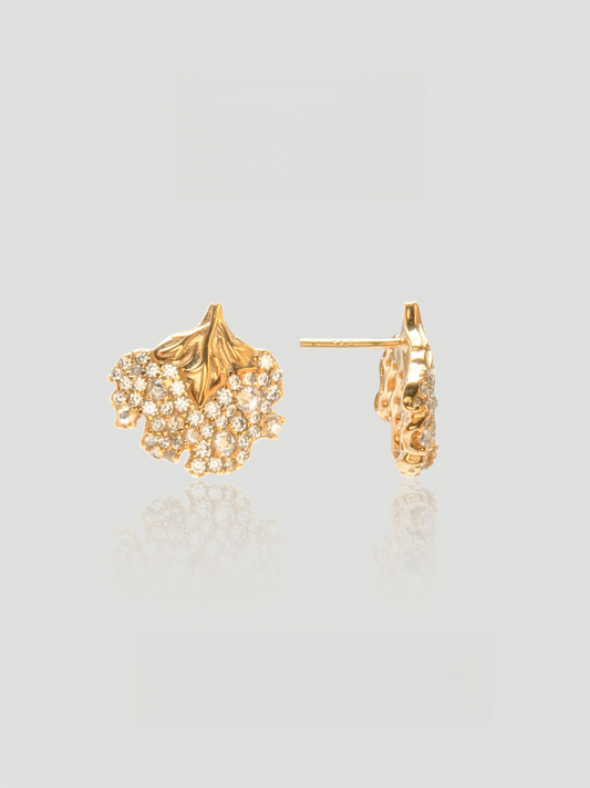 CARV. gold floral leaf stud earrings with pavé crystal cluster and textured leaf detail product close-up