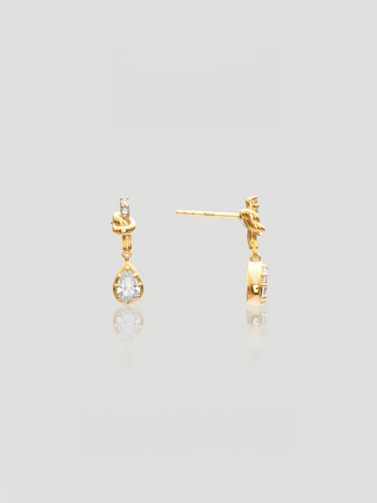 CARV. gold bow knot drop earrings with pear-cut clear stones and delicate teardrop design