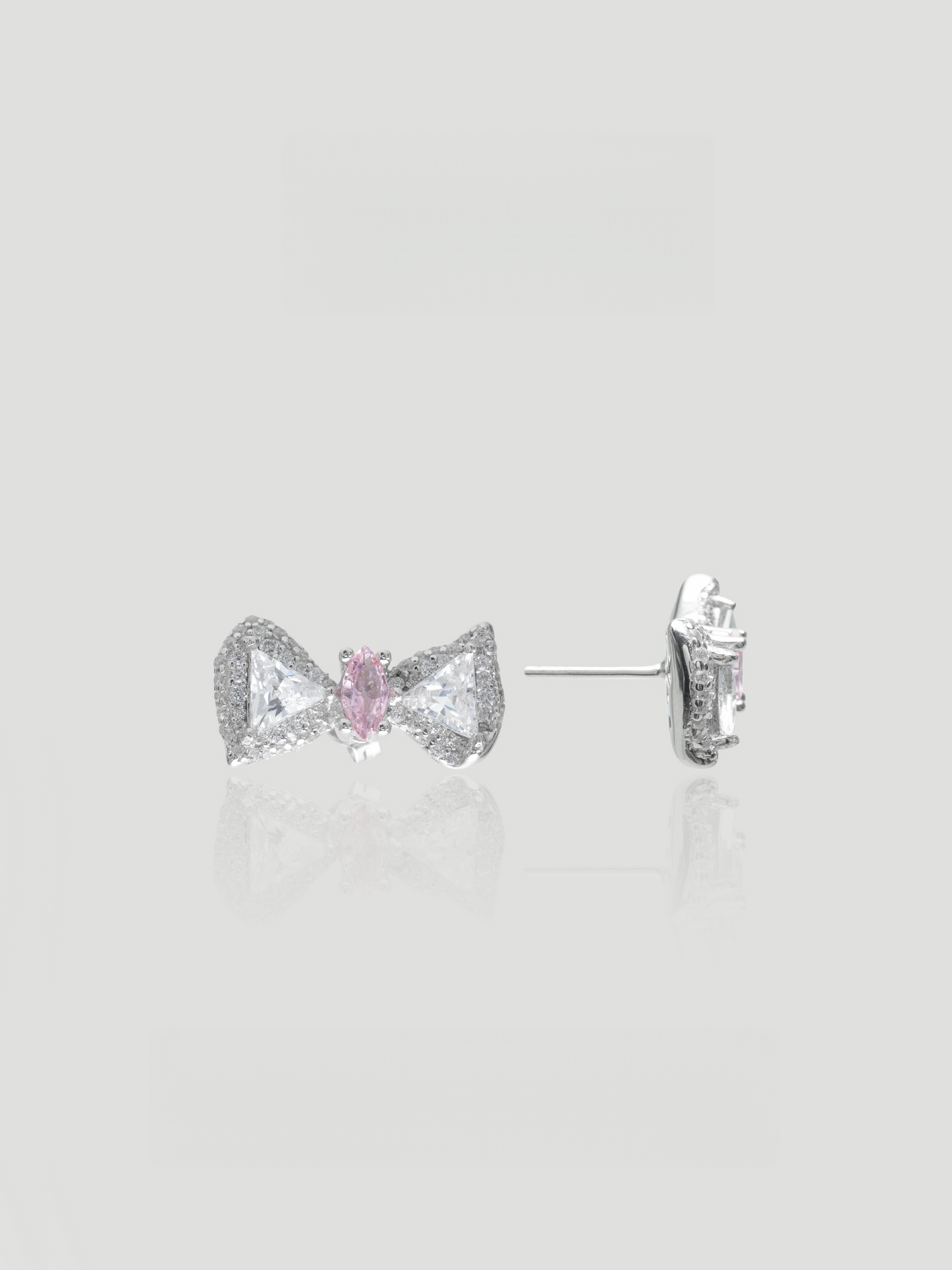 CARV. silver bow stud earrings with pink centre stone, pavé detail and post back