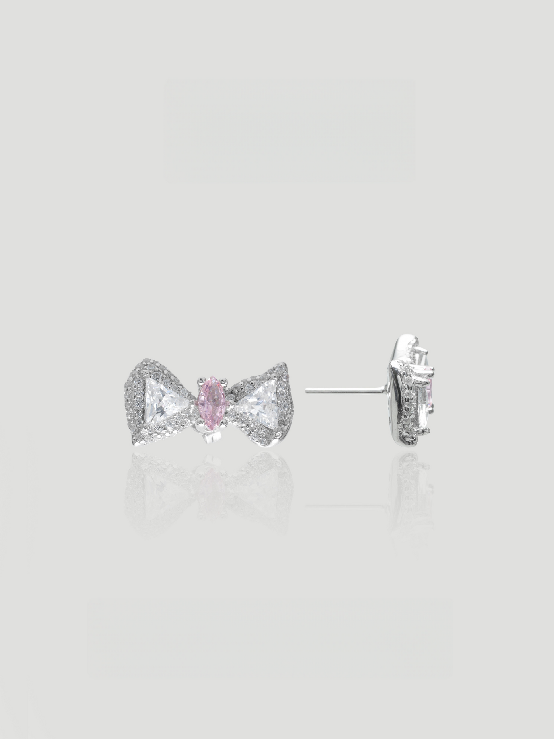 CARV. silver bow stud earrings with pink centre stone, pavé detail and post back