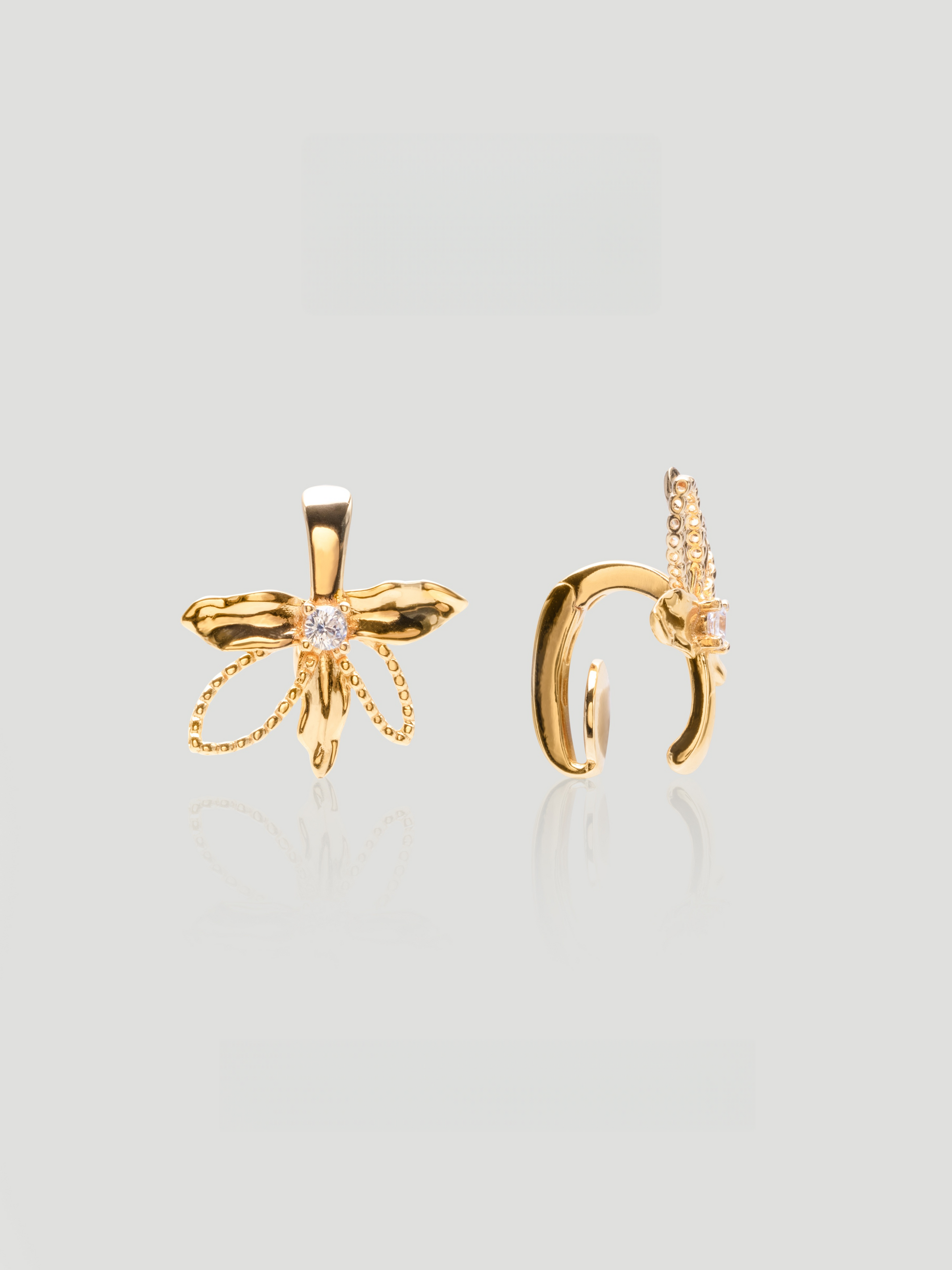 CARV. gold bow hoop earrings with sculptural bow shape and pavé crystal detail