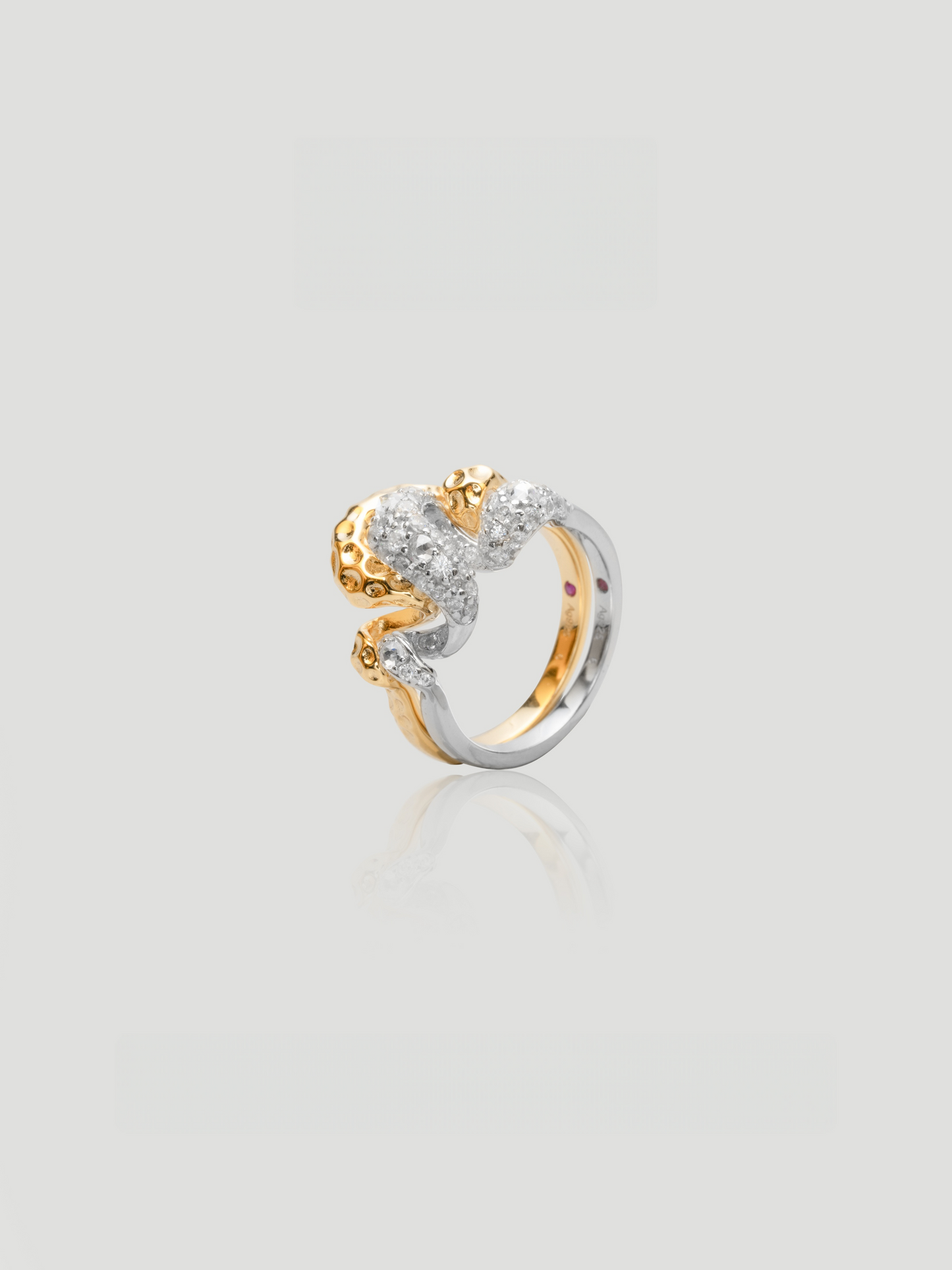 CARV. two-tone sculptural ring set with gold and silver bands and pavé detail