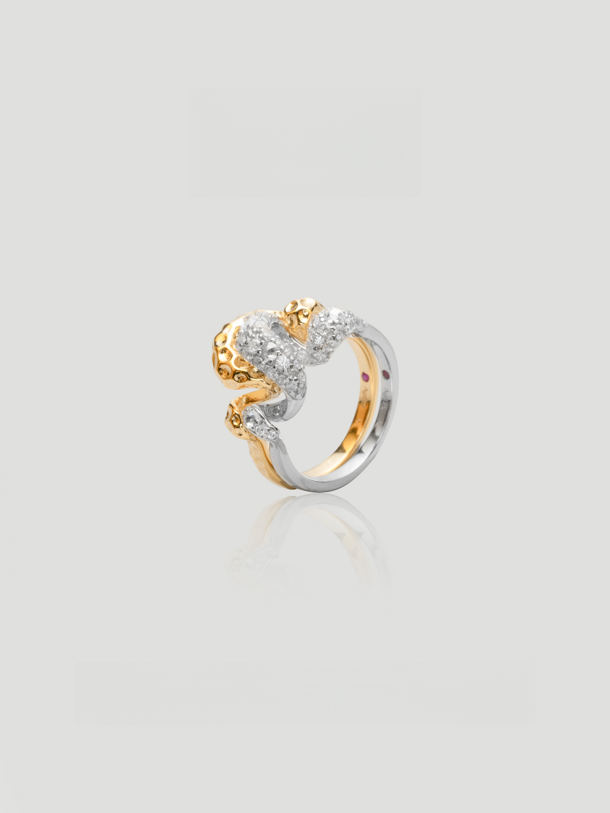 CARV. two-tone sculptural ring set with gold and silver bands and pavé detail