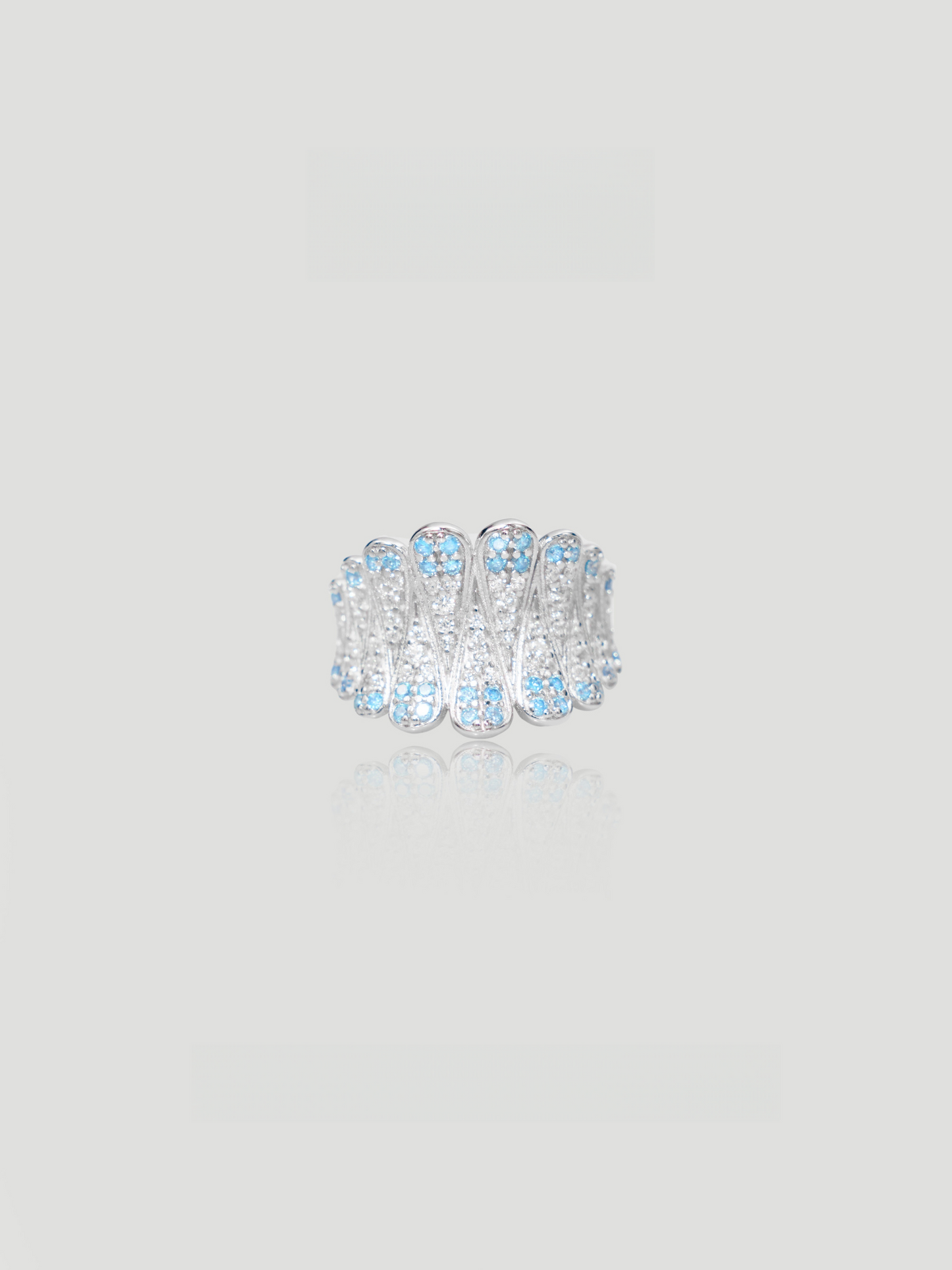 CARV. silver feather statement ring with layered feather design and blue stones