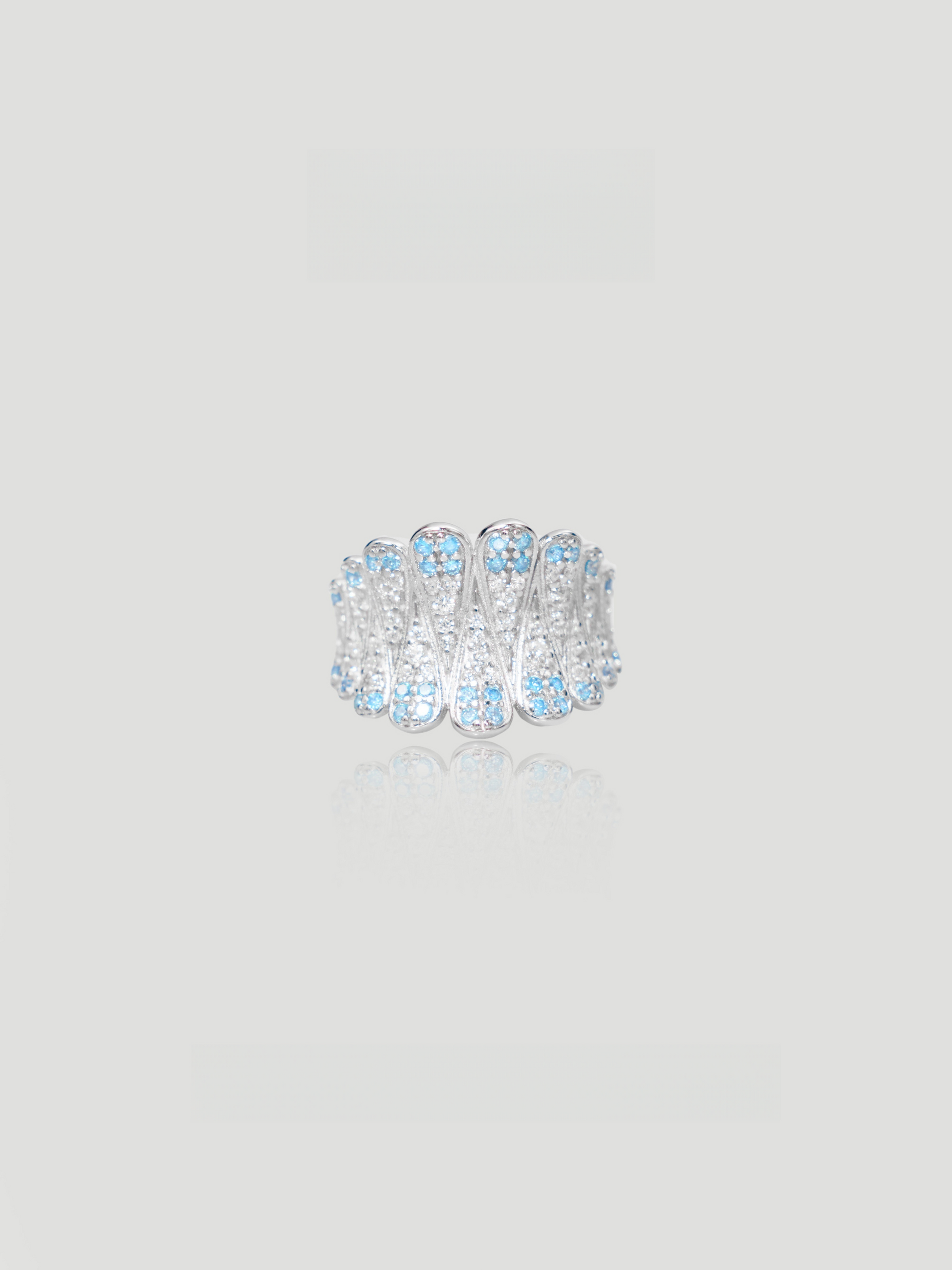 CARV. silver feather statement ring with layered feather design and blue stones