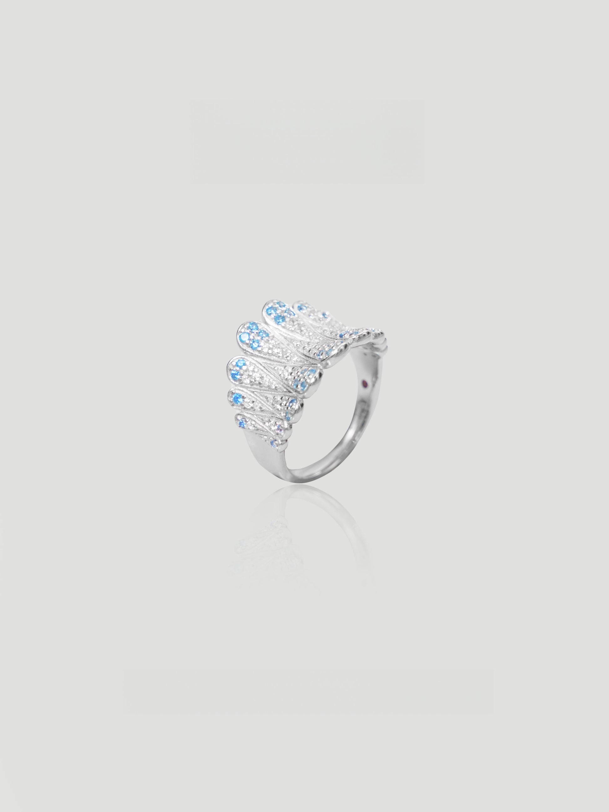 CARV. silver feather statement ring with layered openwork and blue stone accents