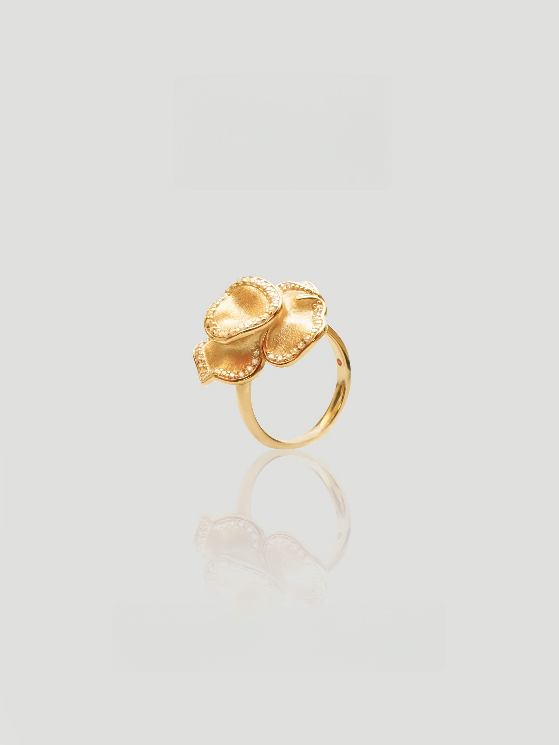CARV. gold floral statement ring with layered petals, pavé edge detail and wide band