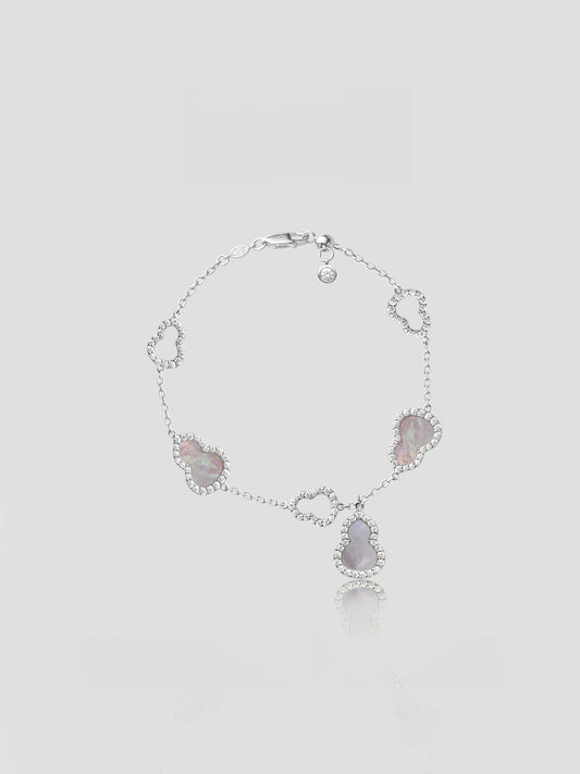 CARV. silver gourd charm bracelet with pink stone details and halo-set drop charm product close-up