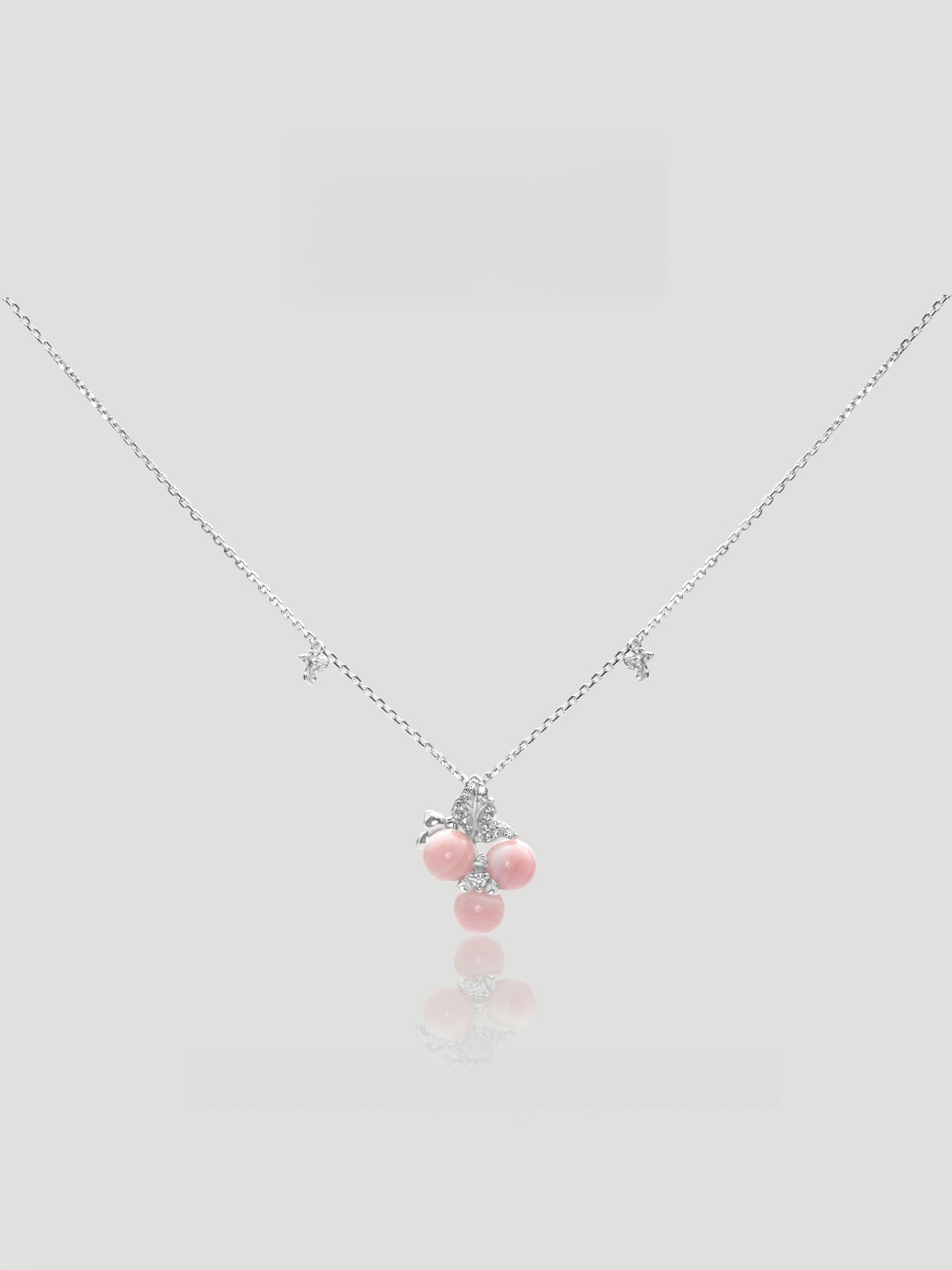 CARV. silver pink berry cluster necklace with crystal bow detail, pink bead drops and fine chain