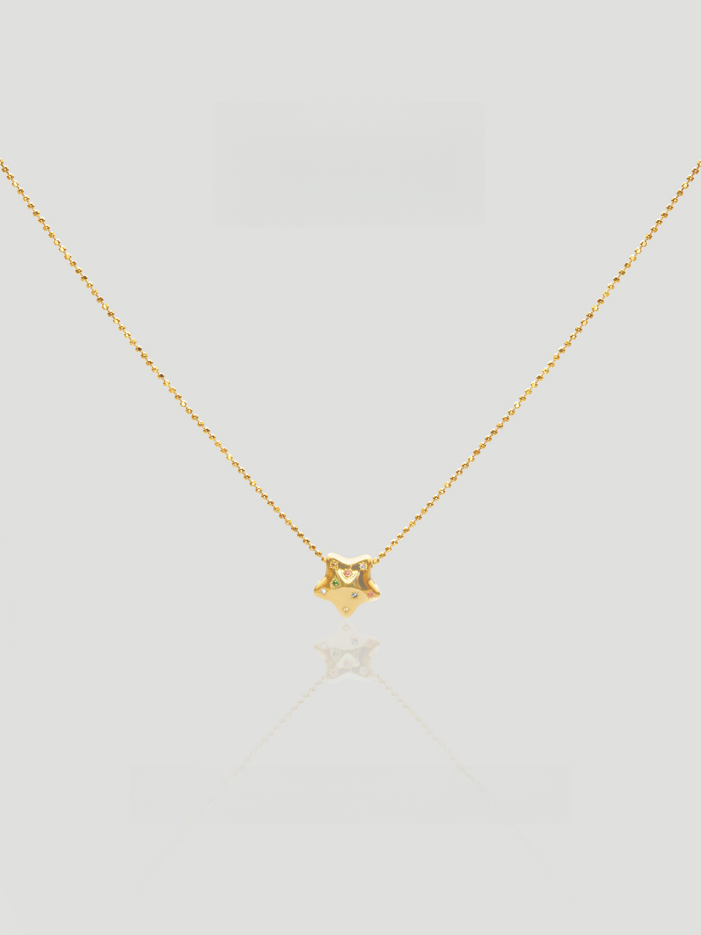 CARV. gold star zircon pendant necklace with fine chain and small sparkling star charm