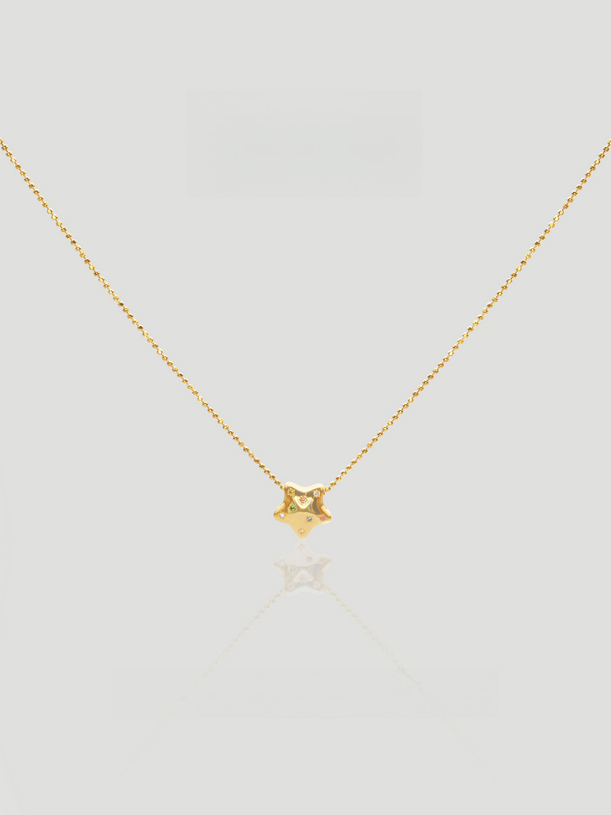 CARV. gold star zircon pendant necklace with fine chain and small sparkling star charm