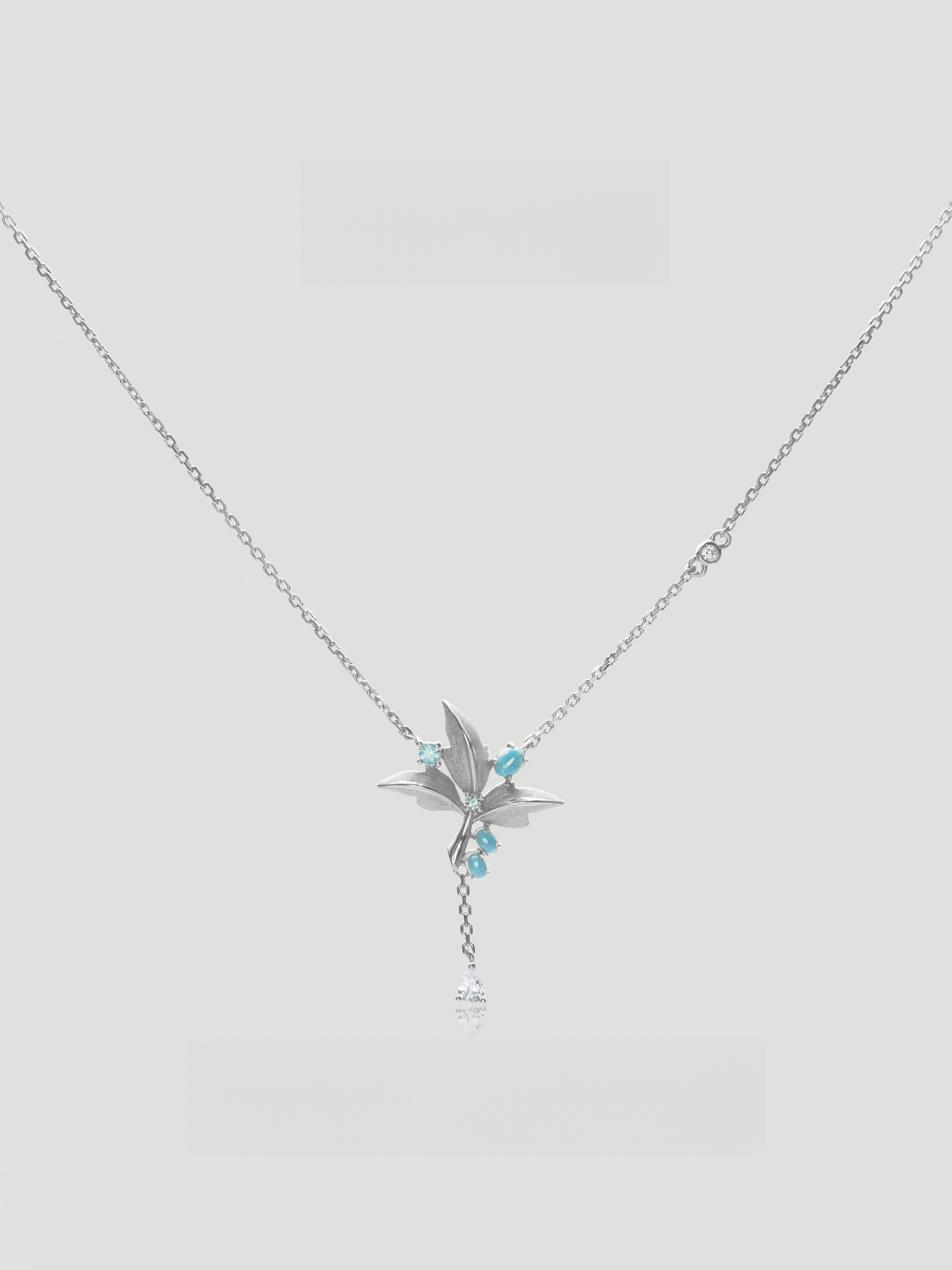 CARV. silver lily pendant necklace with turquoise accent, fine chain and delicate tassel drop
