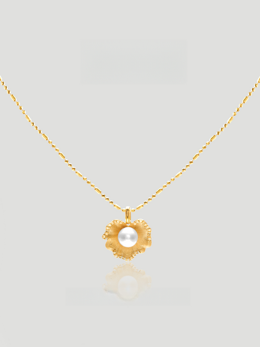 CARV. gold pearl flower pendant necklace with sculptural petal charm and round pearl centre