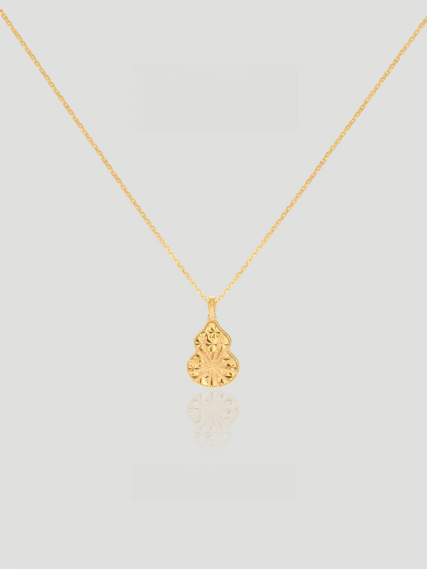 CARV. gold filigree gourd pendant necklace with engraved drop pendant product close-up