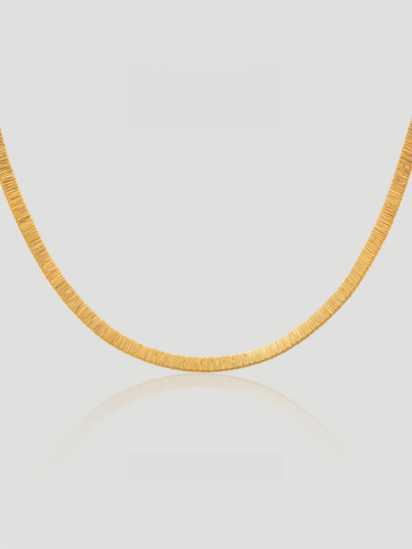 CARV. gold textured collar necklace with curved short chain design and fine ridged detail
